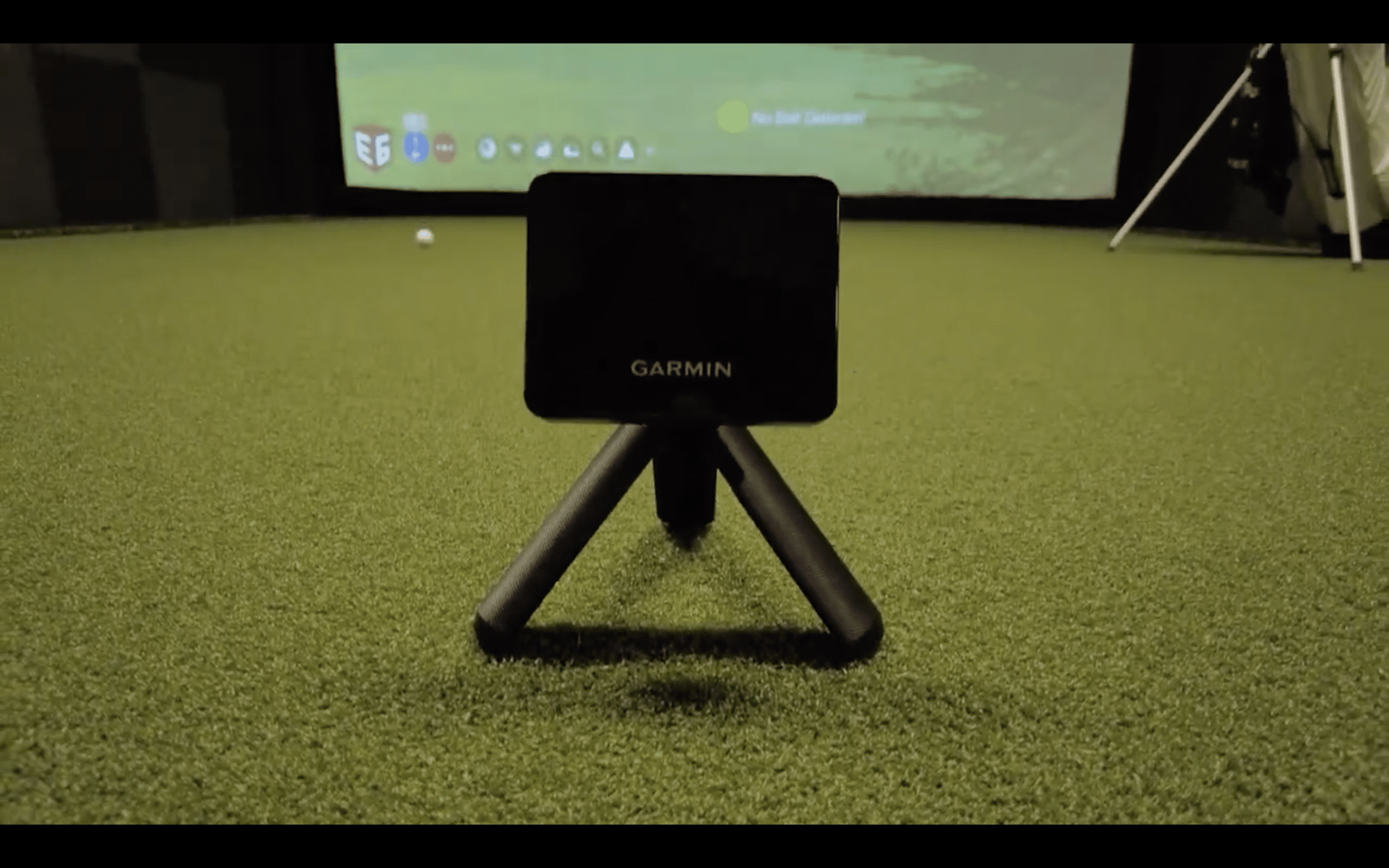 Garmin golf launch monitor on indoor green
