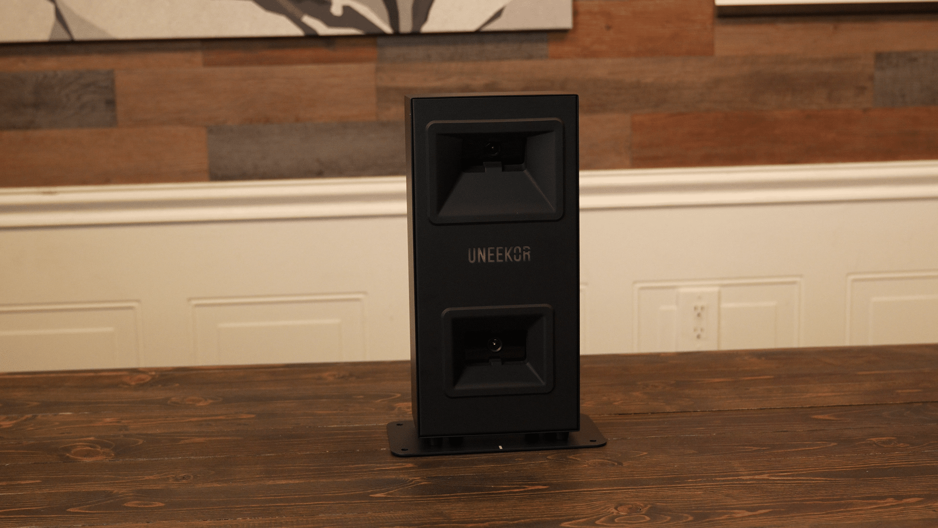 Uneekor golf launch monitor on wooden table