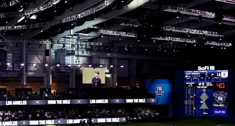 Indoor golf event scoreboard at SoFi Center
