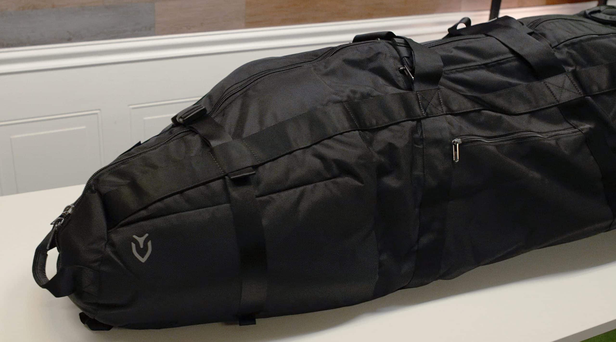 Large black duffel bag on white table