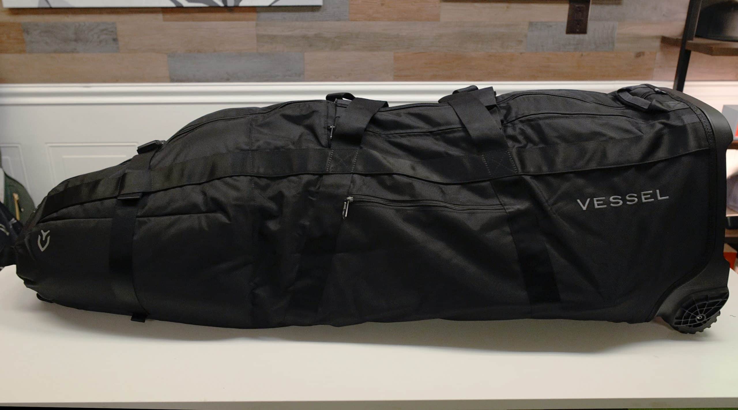 Black Vessel travel golf bag on table