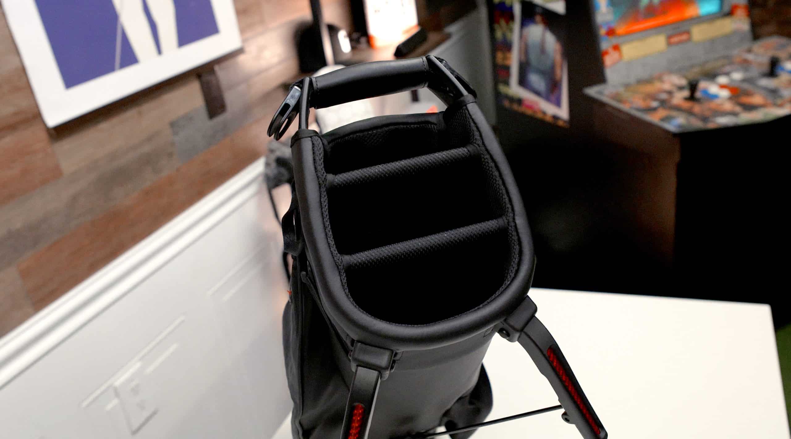 Open black backpack with padded dividers