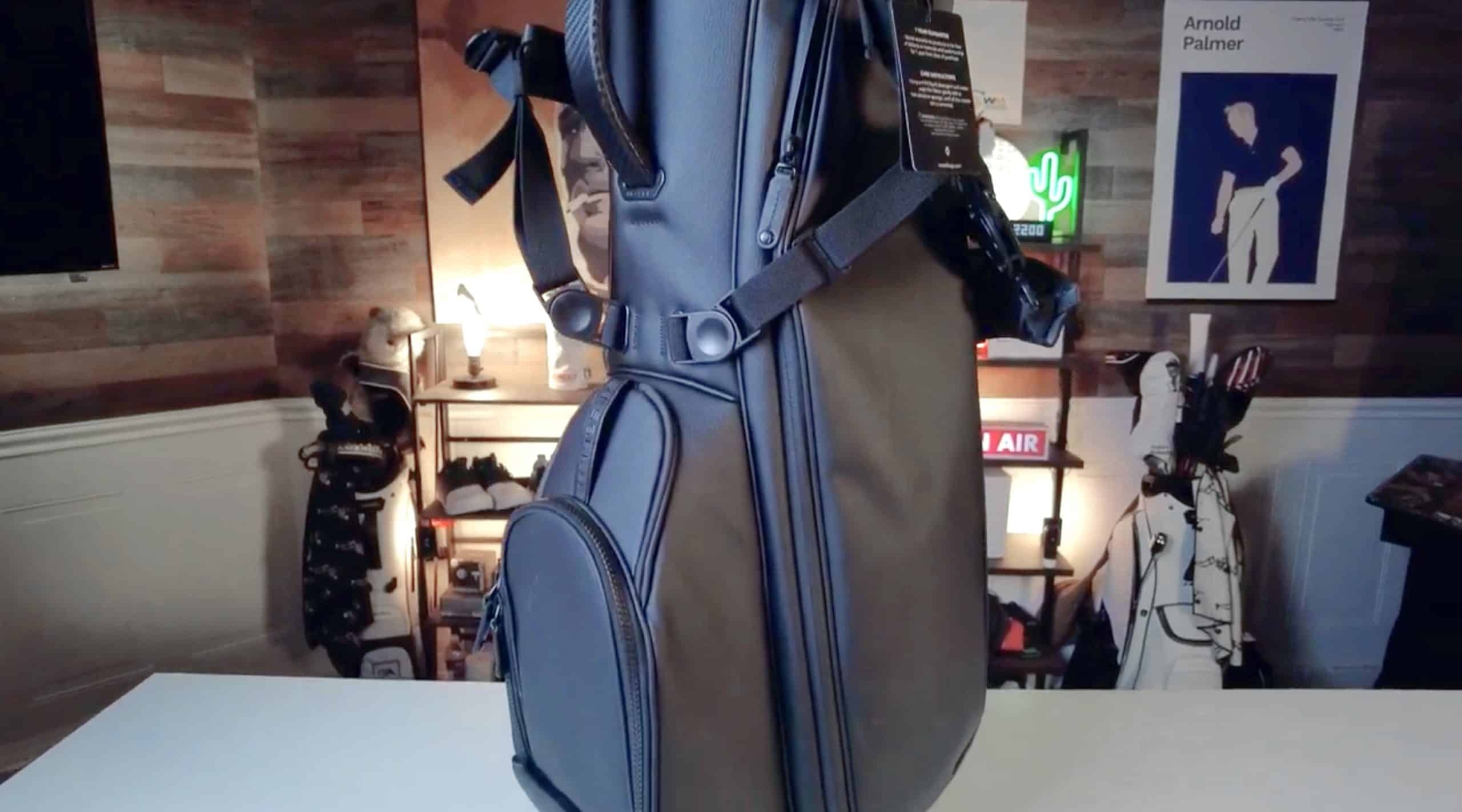 Black golf bag on display table