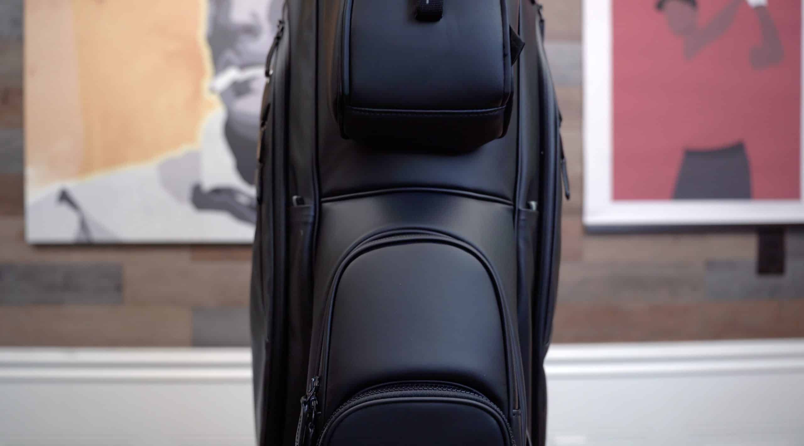 Black golf bag with multiple compartments
