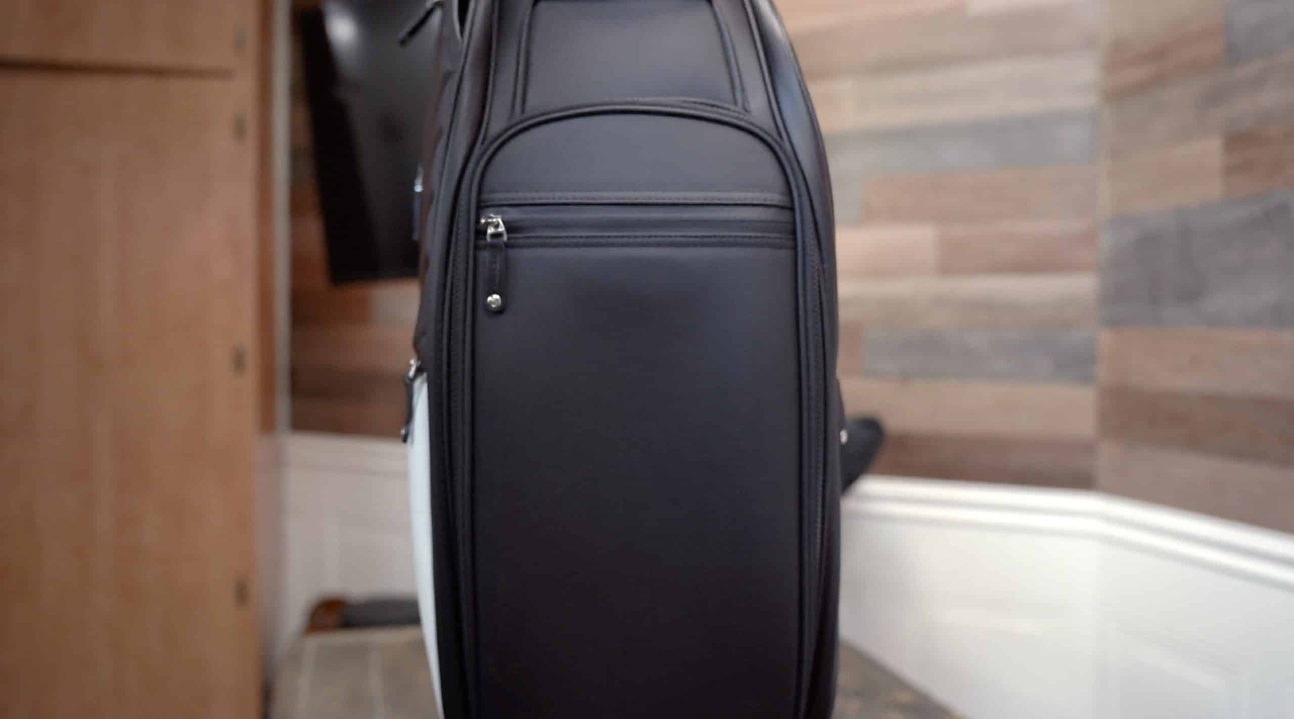 Black leather backpack with zippered pocket