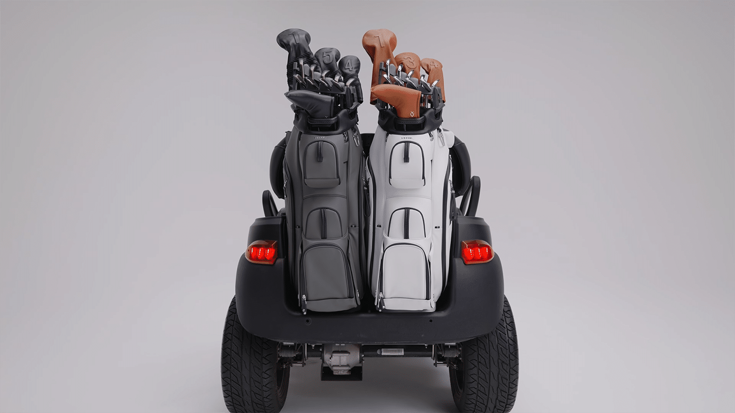 Golf cart carrying two sets of golf bags