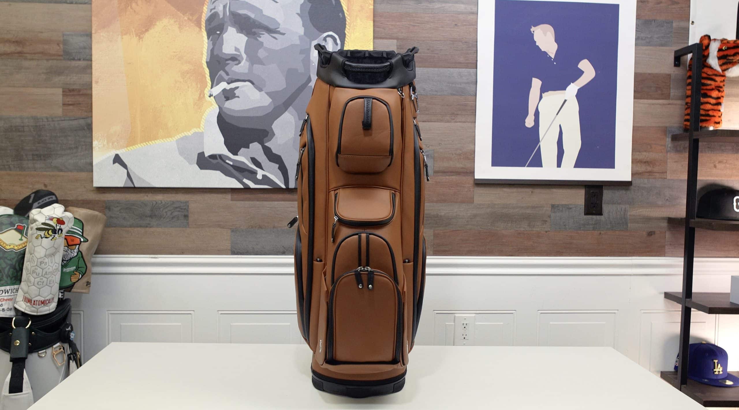 Brown leather golf bag on display table