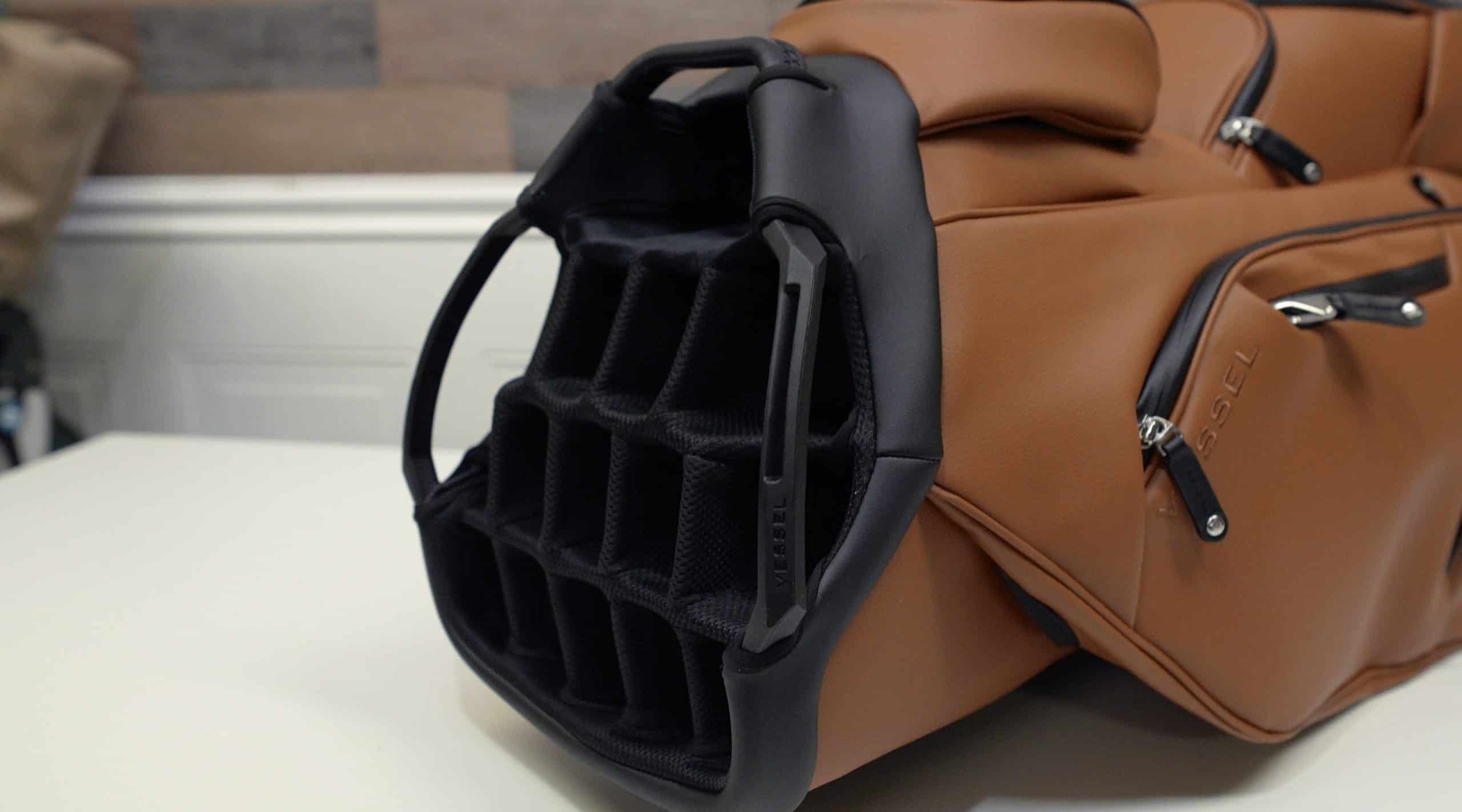 Brown golf bag with black club dividers