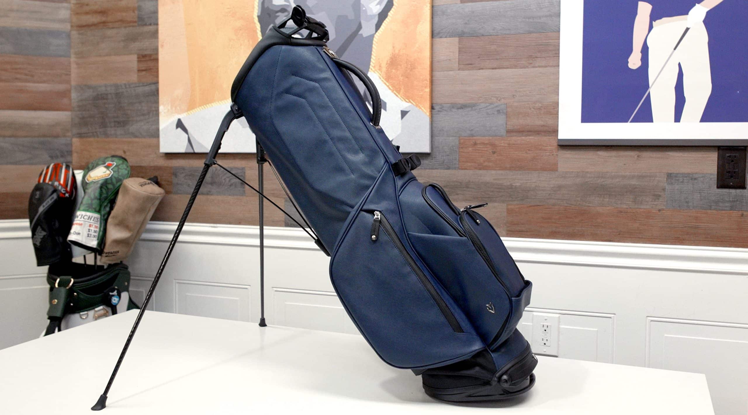 Blue golf stand bag on white table