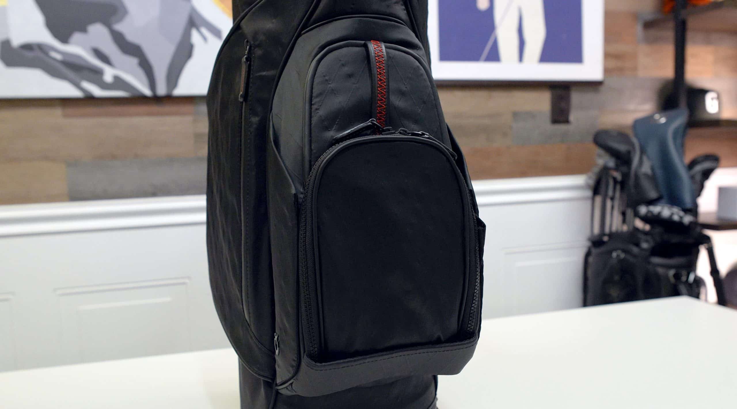Black golf bag with zippered pocket