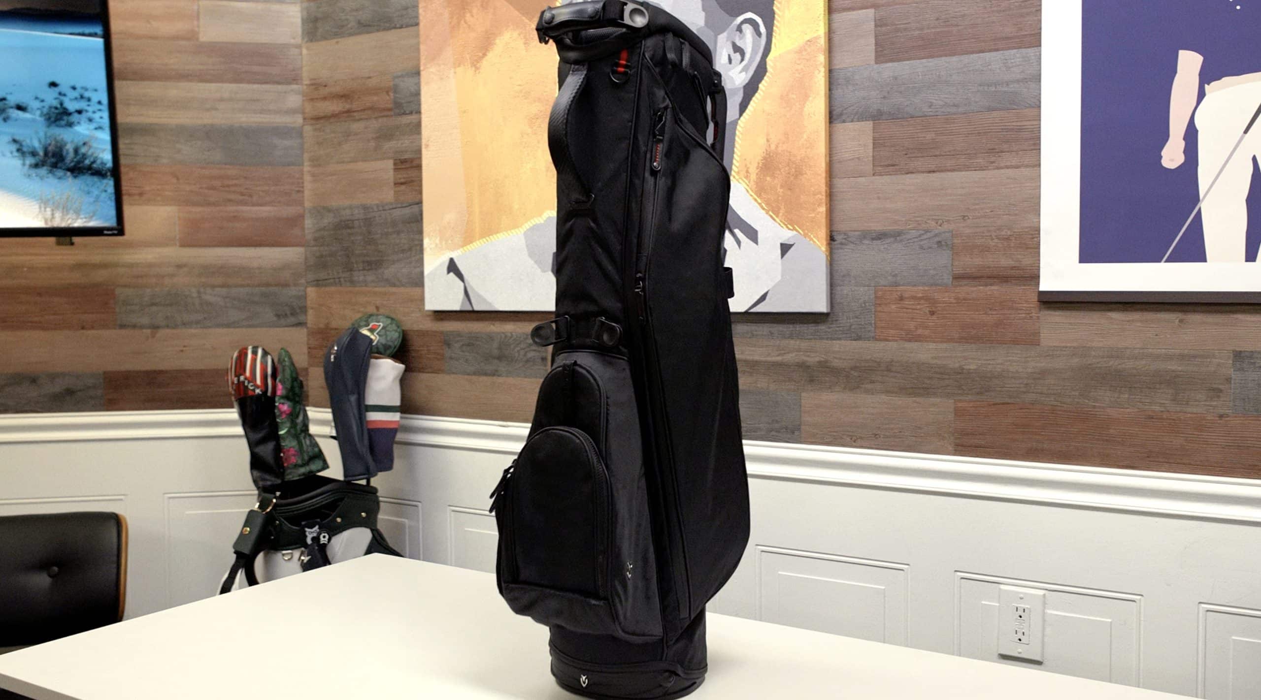 Black golf bag on table indoors