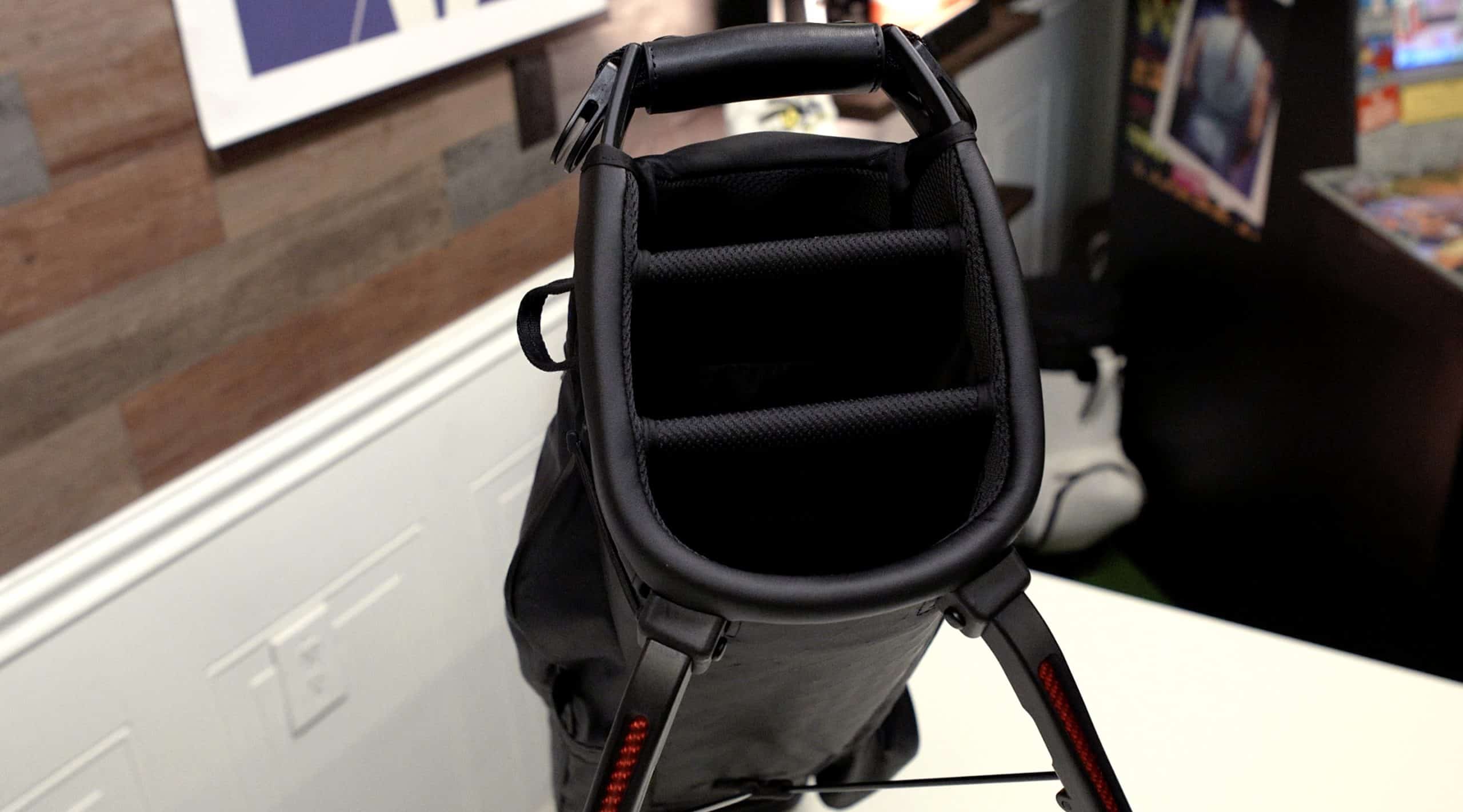 Black golf bag with padded club dividers