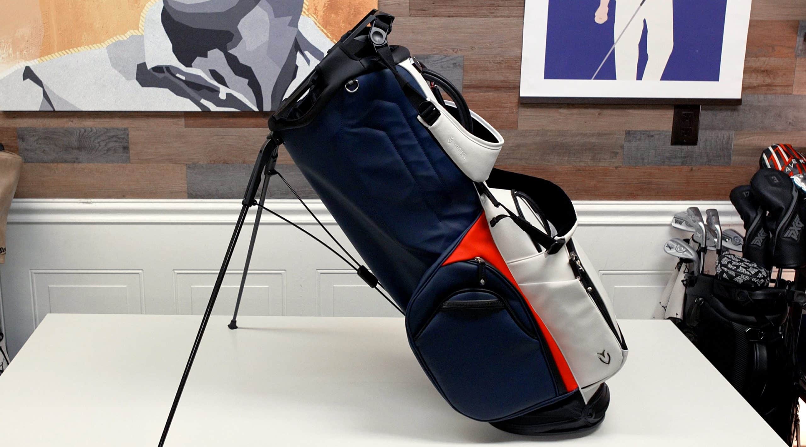 Blue and white golf bag on display table