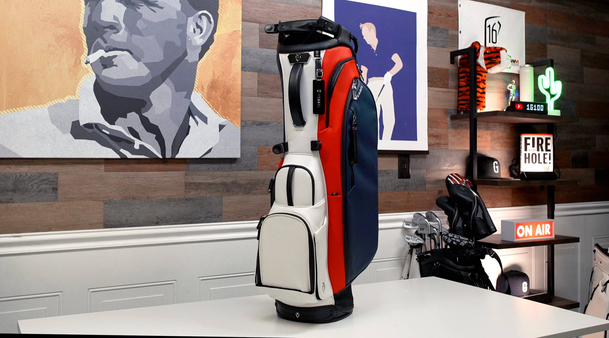 Red, white, and blue golf bag on table