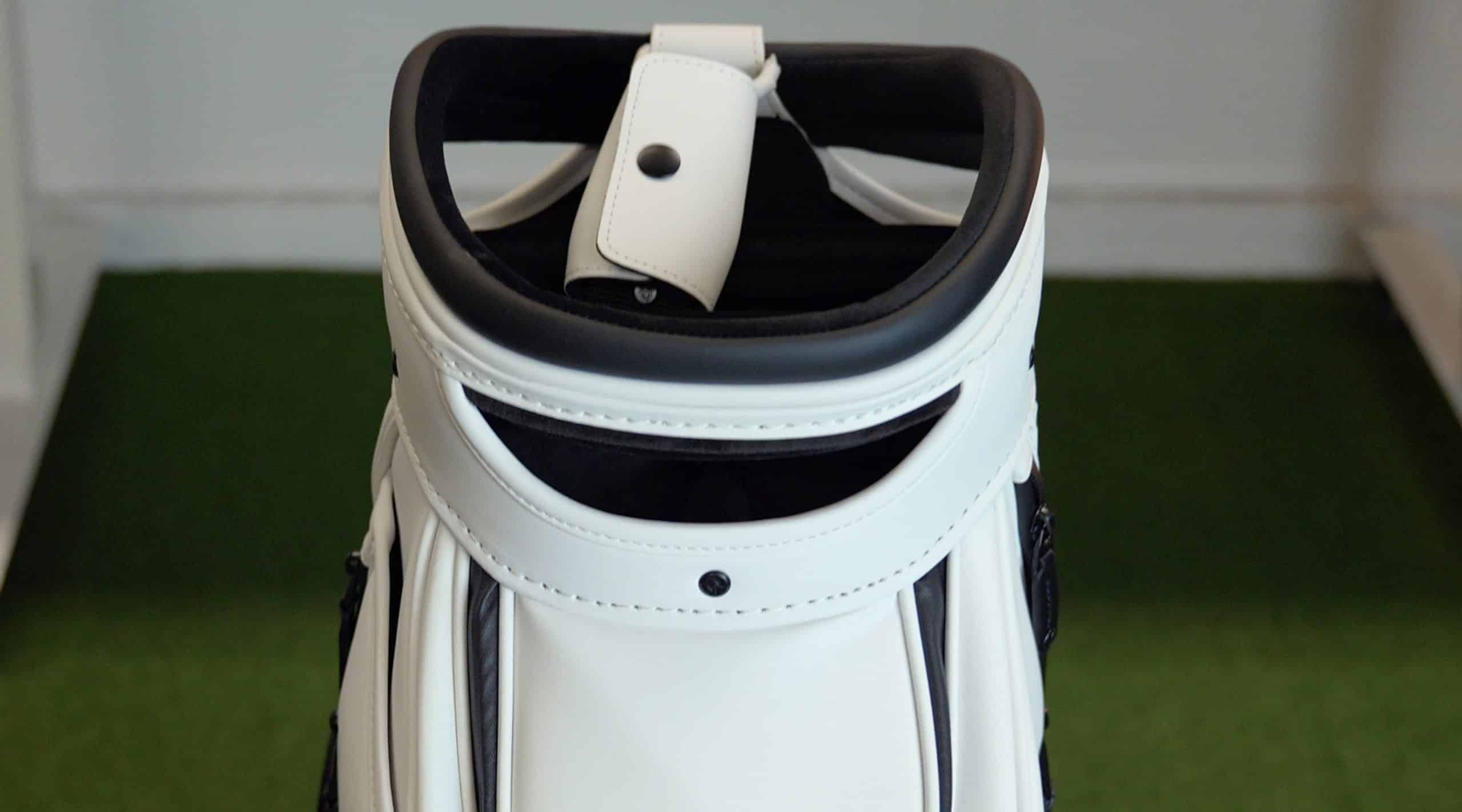 White golf bag on green turf