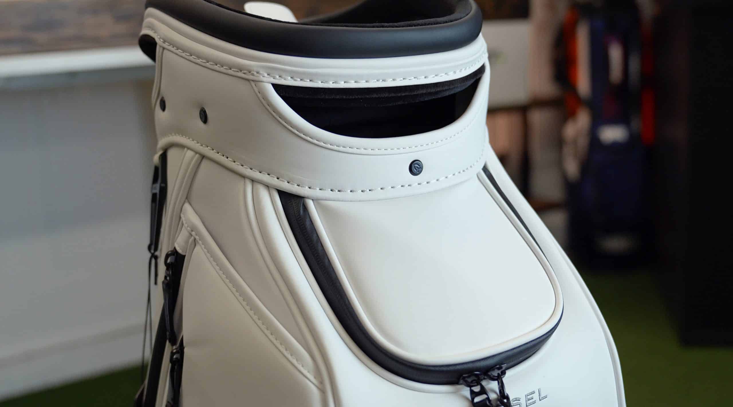 White leather golf bag with black trim