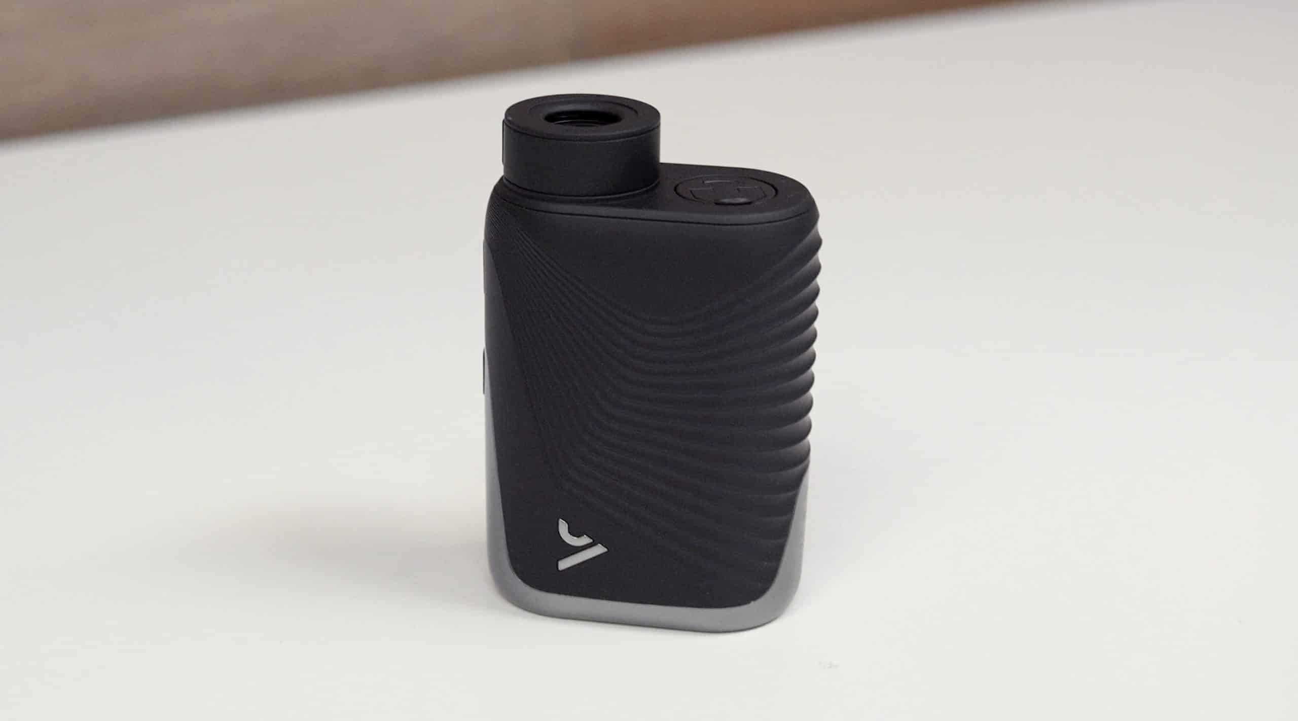 Black portable vaporizer on white surface