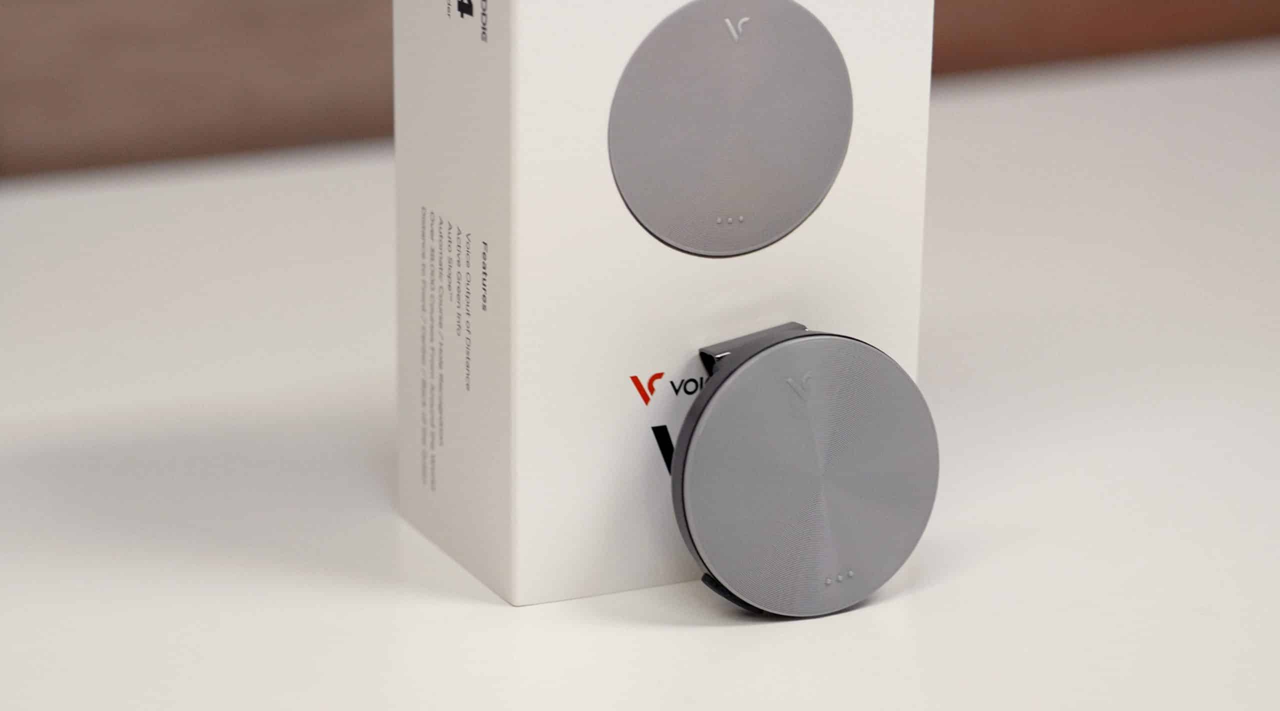 Gray circular electronic device with packaging box