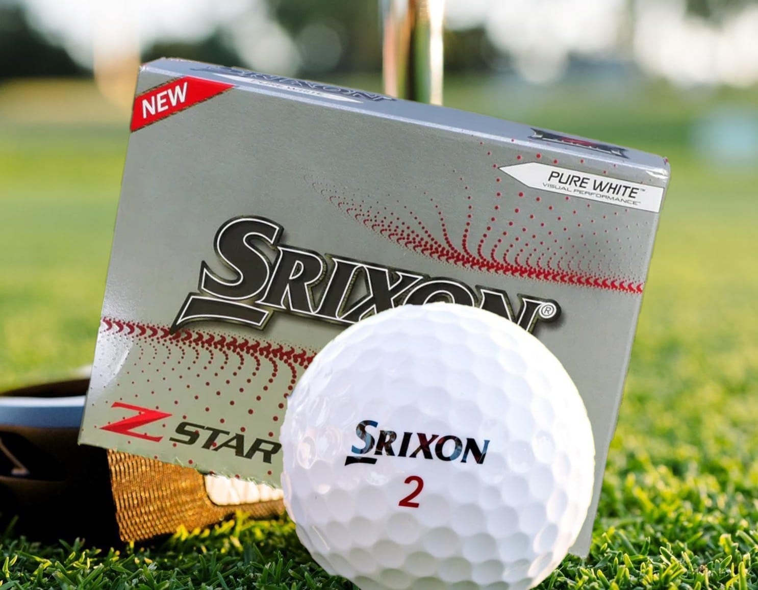 Srixon Z-Star golf ball and box on grass
