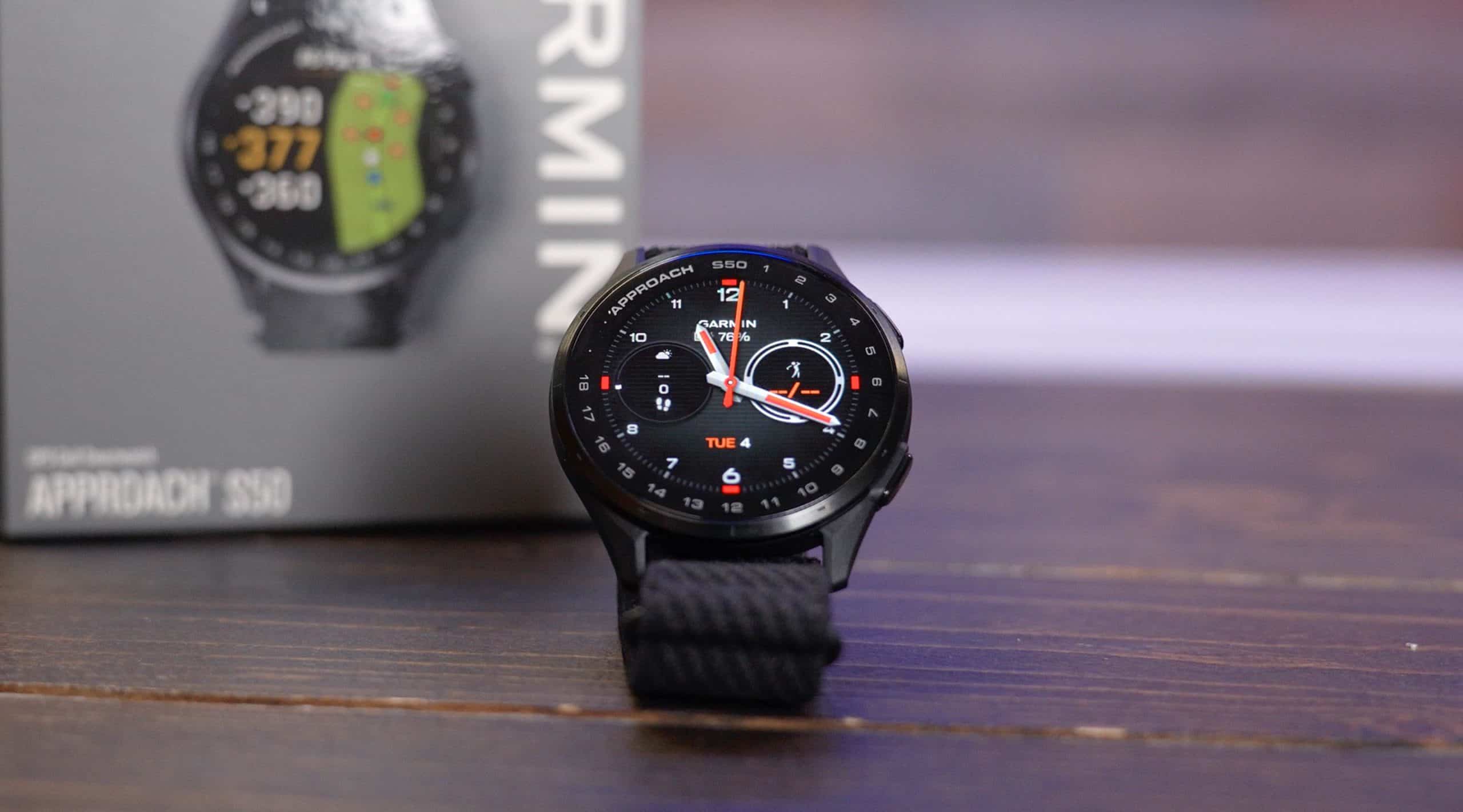 Garmin Approach S50 smartwatch on wooden table