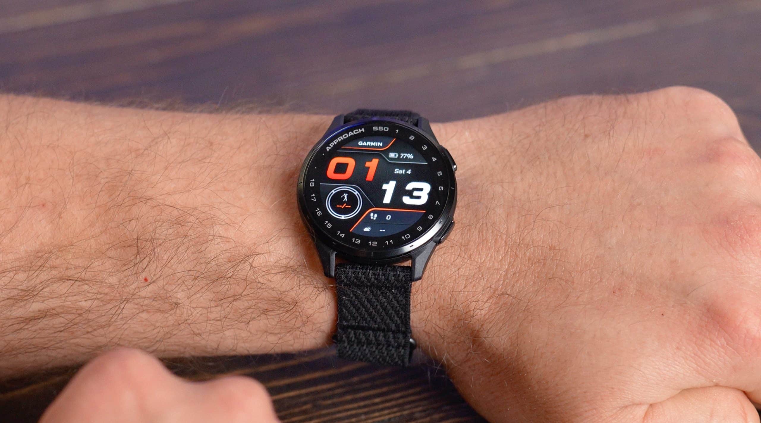 Smartwatch displaying time and fitness data on wrist