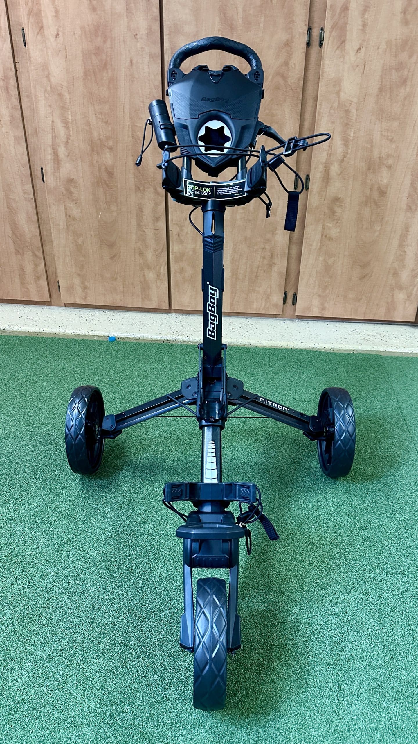 BagBoy Nitron three-wheel golf push cart indoors