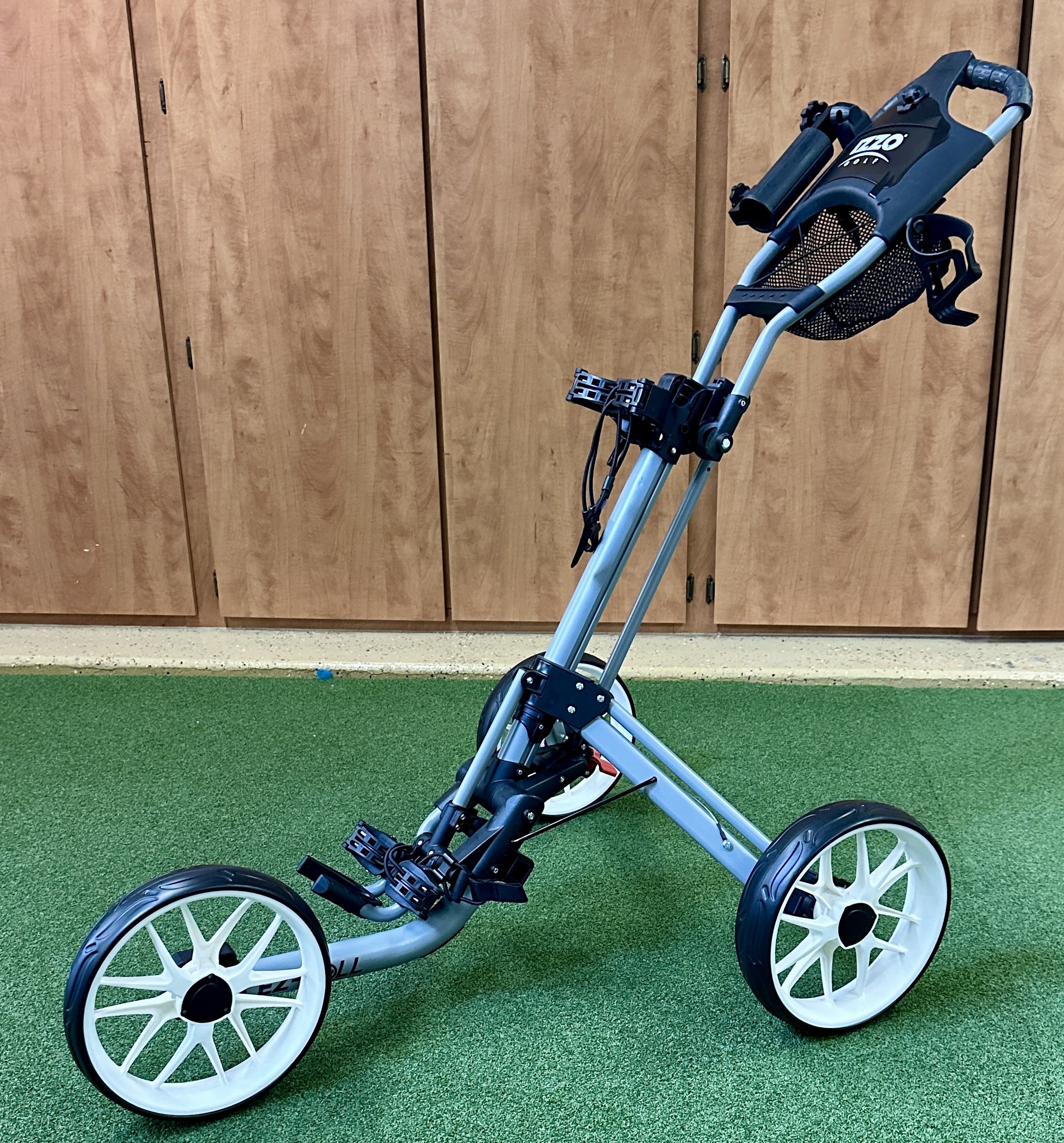 Foldable three-wheel golf push cart indoors