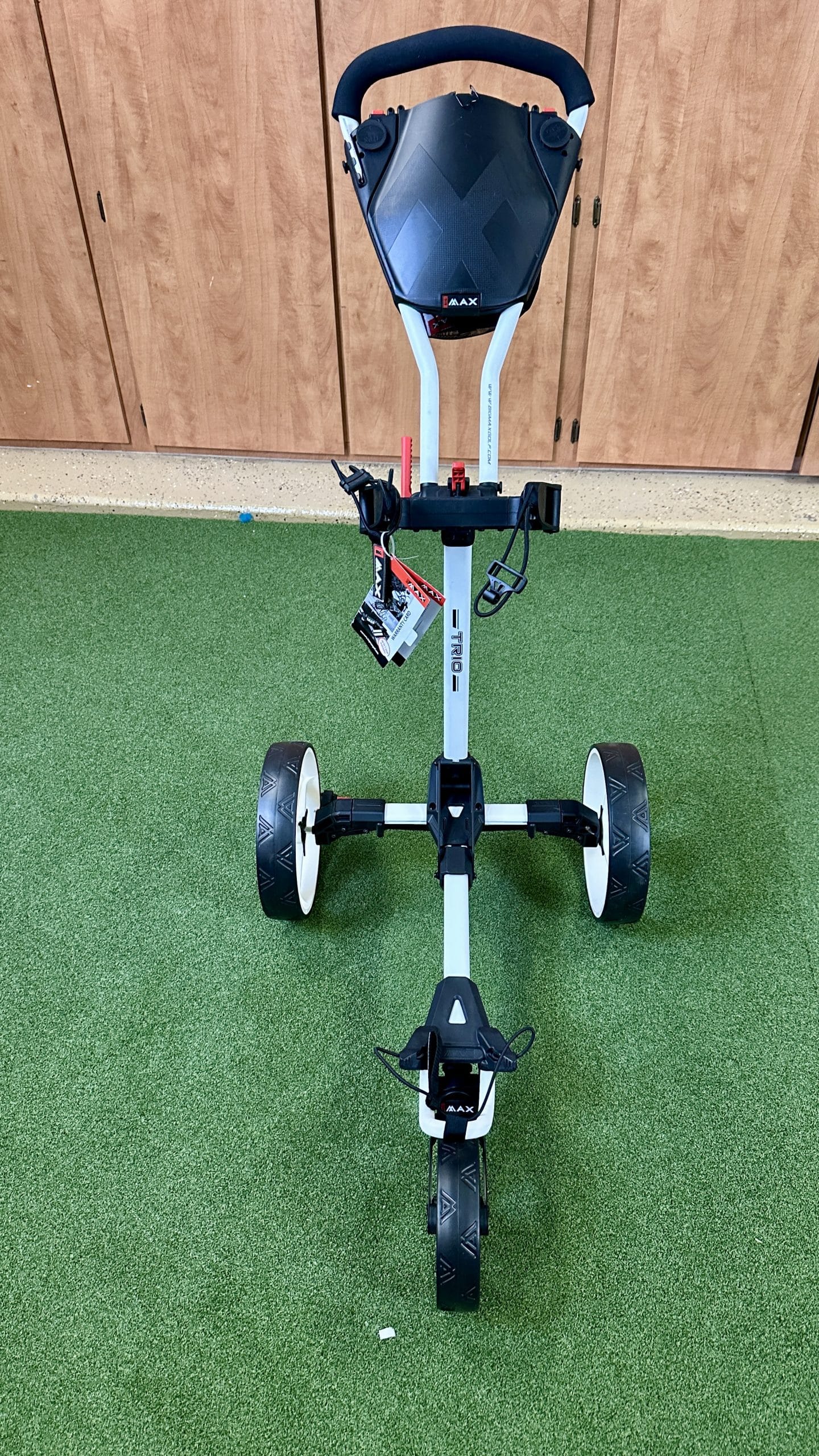 Three-wheel foldable golf push cart on turf