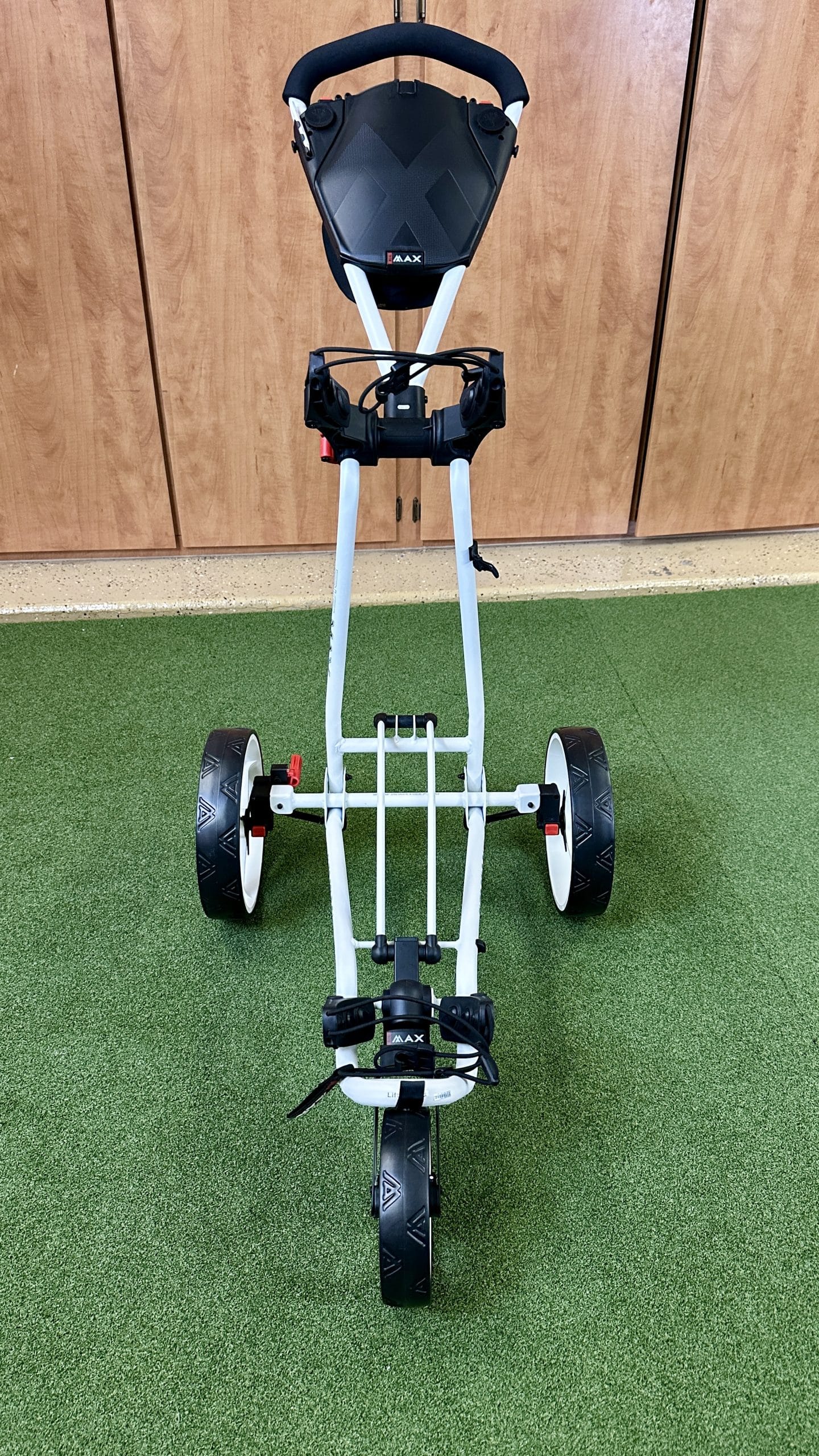 Three-wheel foldable golf push cart indoors