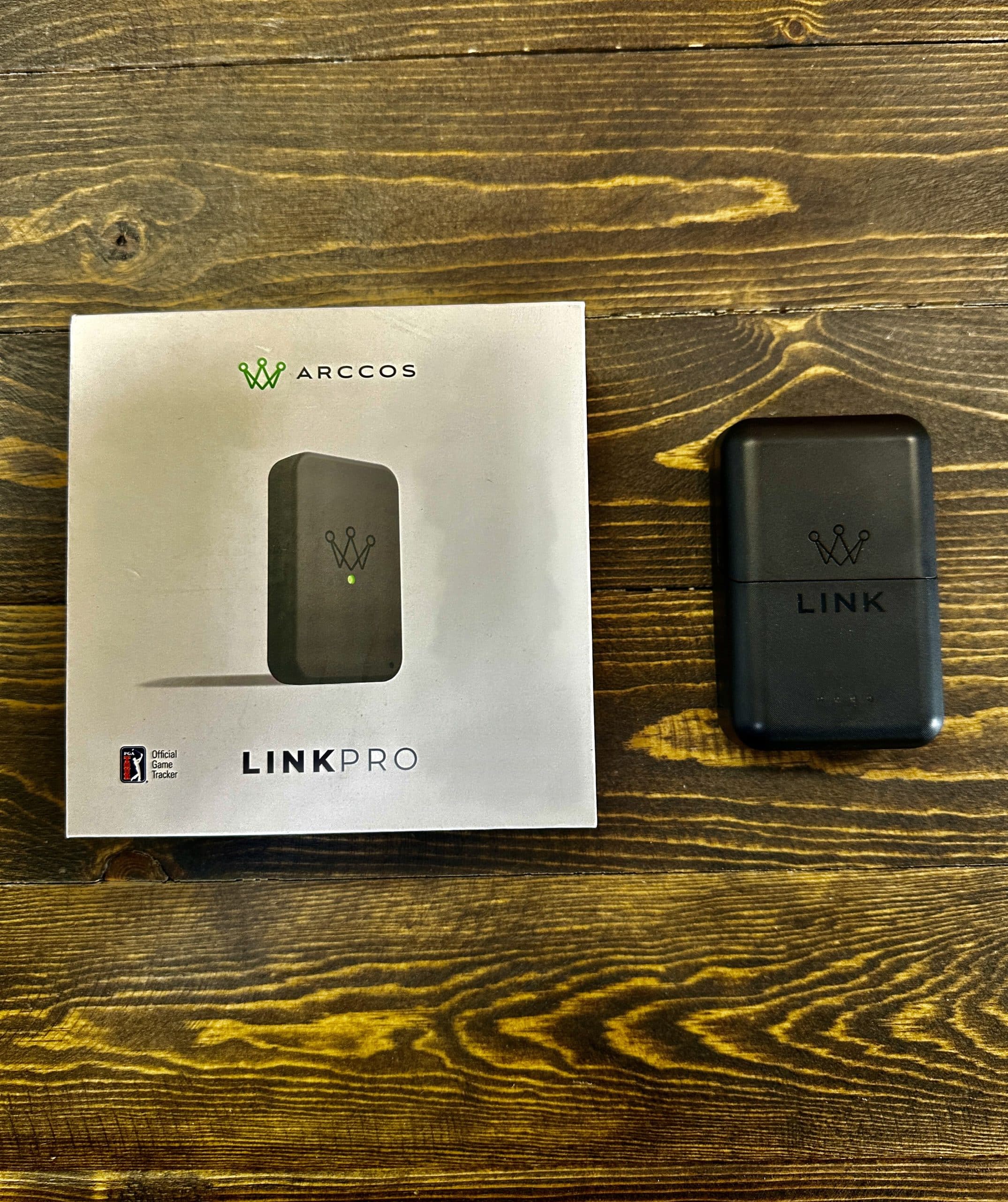 Arccos Link Pro golf tracking device on table