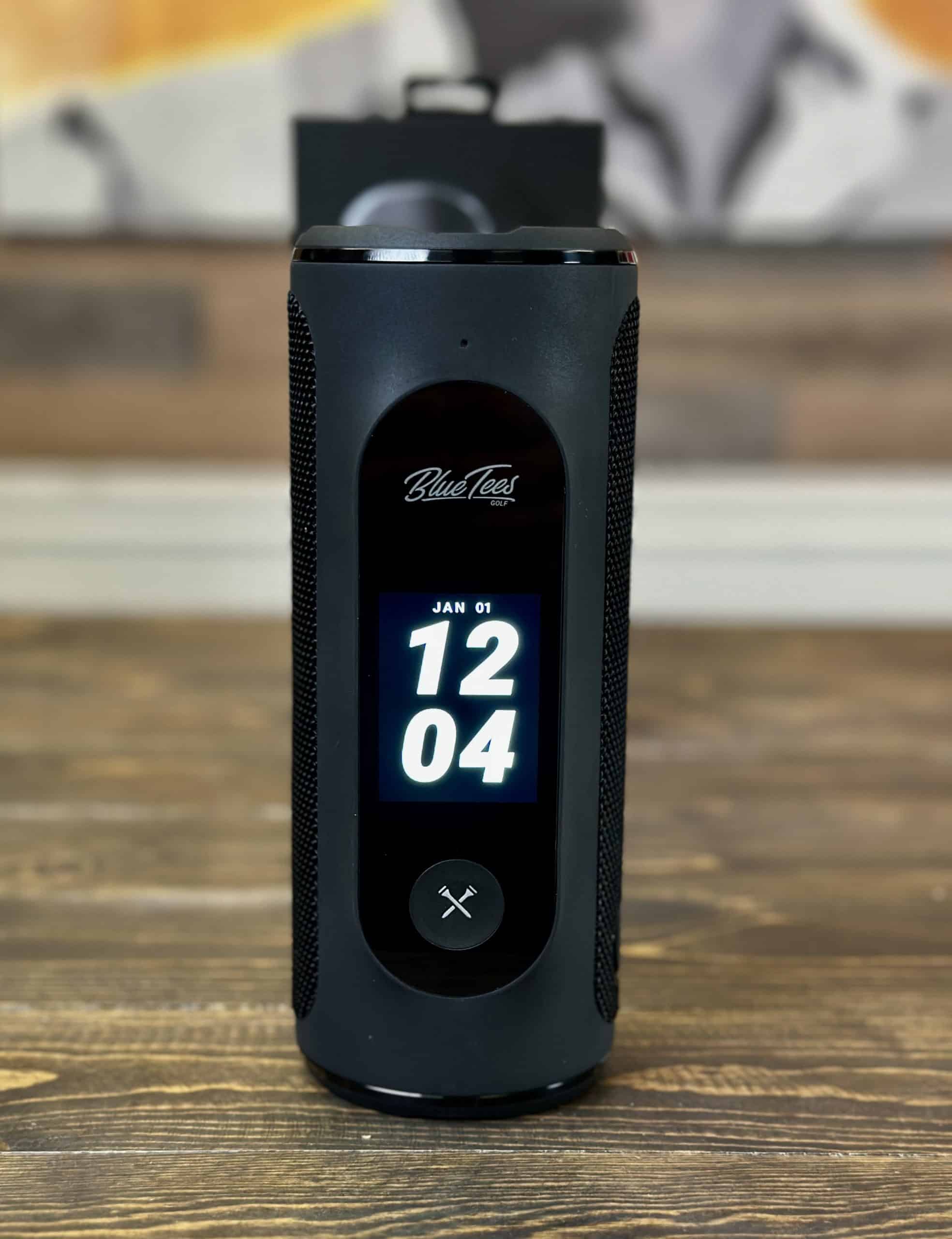 BlueTees portable Bluetooth speaker on wooden table