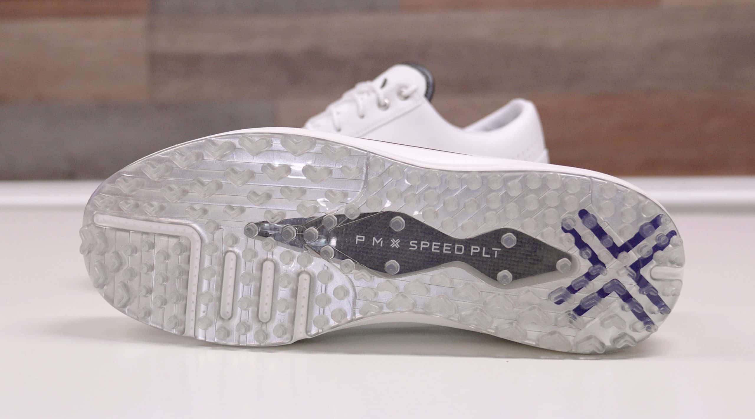 White golf shoe with clear spiked sole