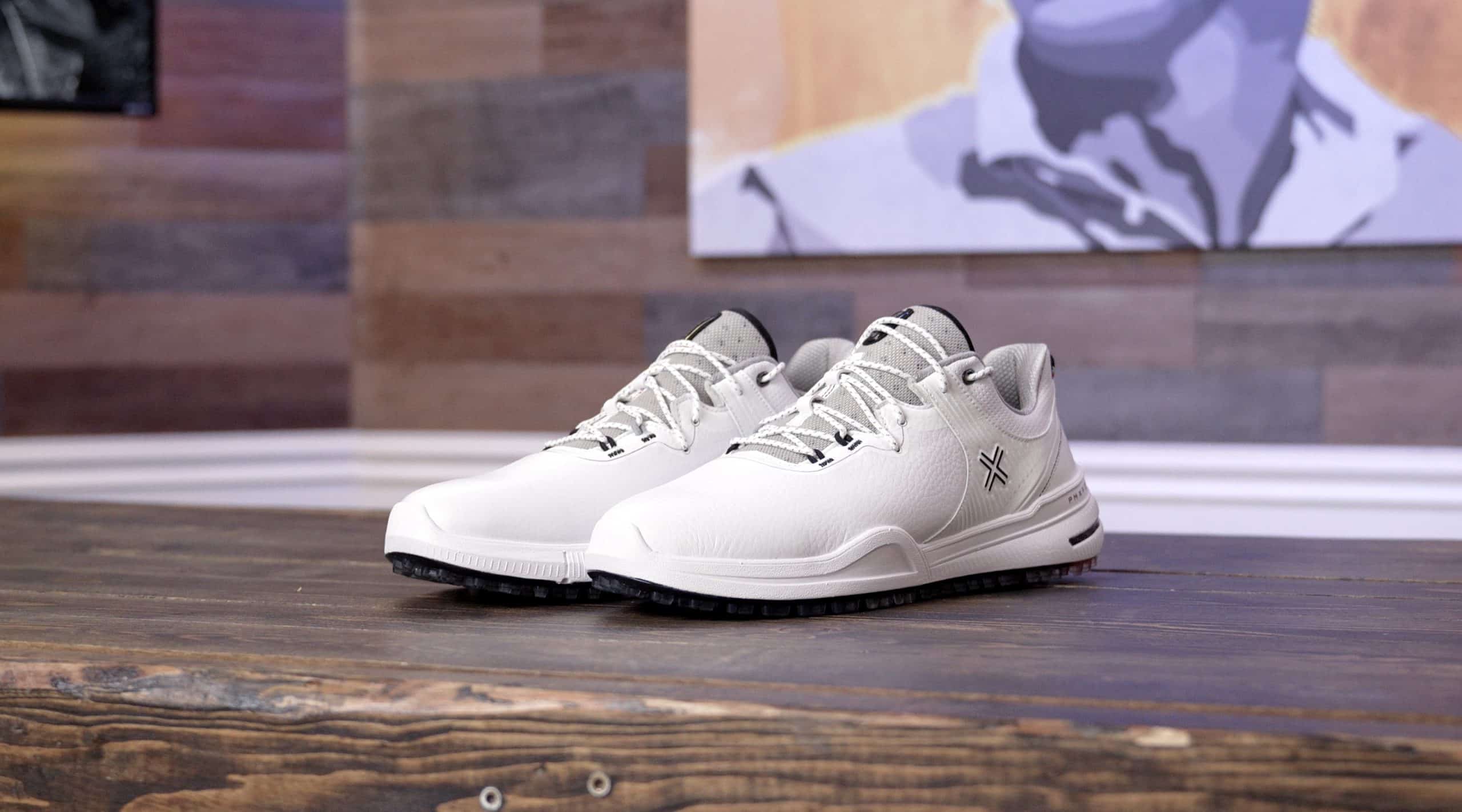 White athletic shoes on wooden surface