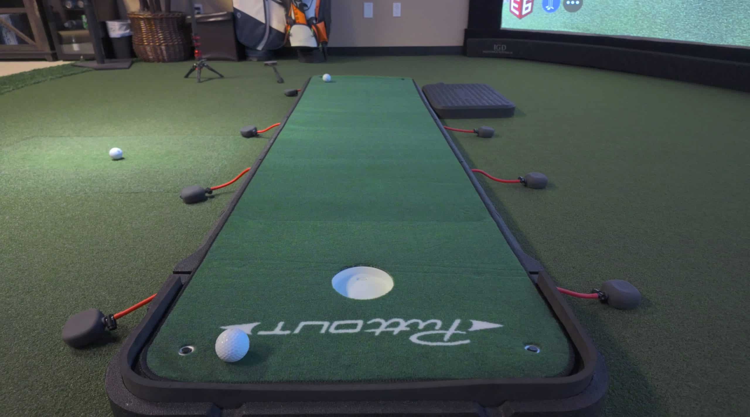 Indoor golf putting green with golf balls