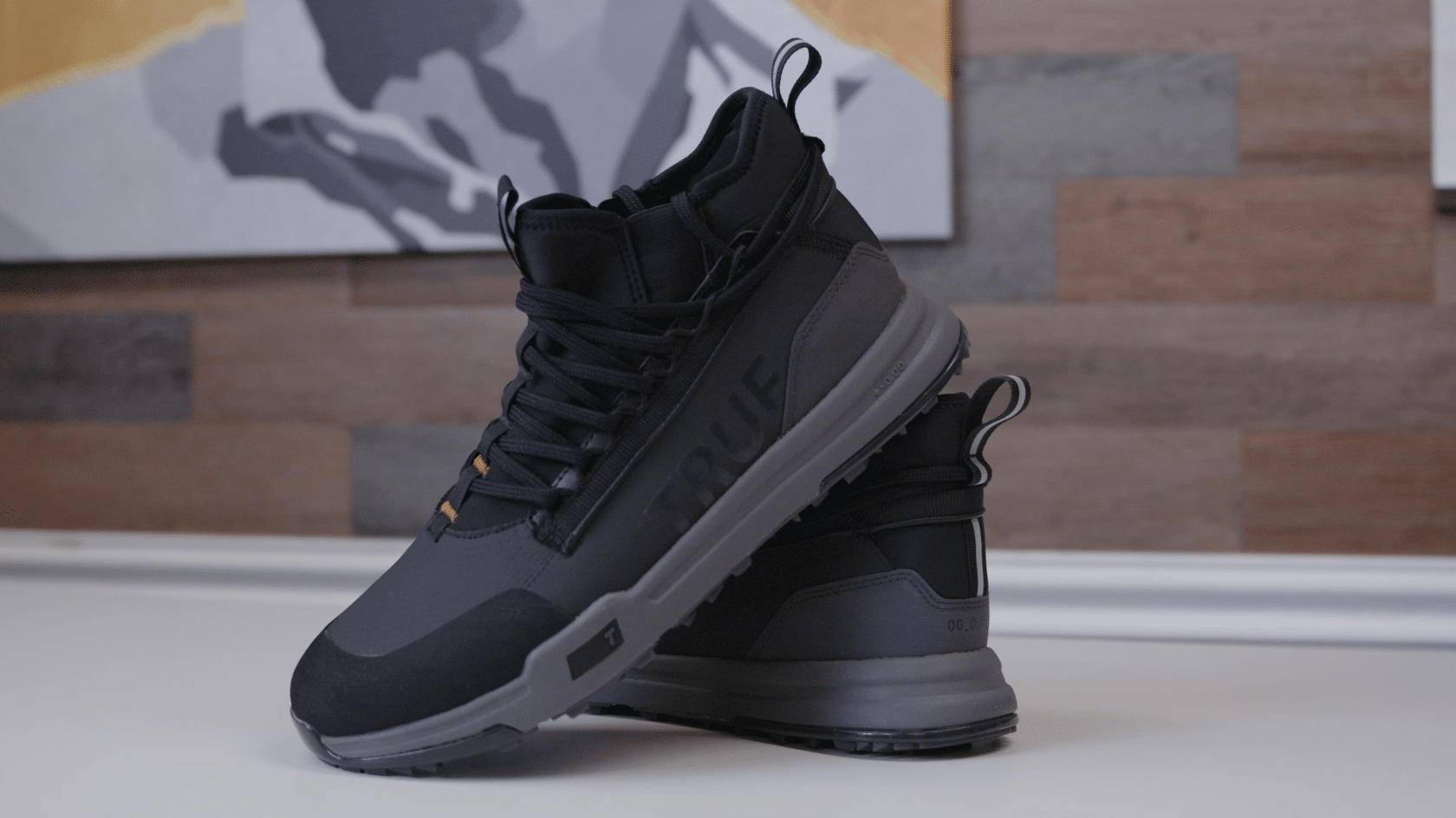 Black high-top athletic shoes on display