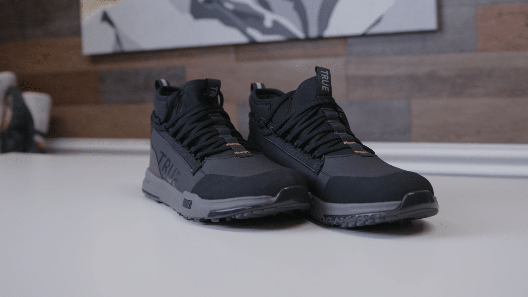 Black and gray athletic shoes on table