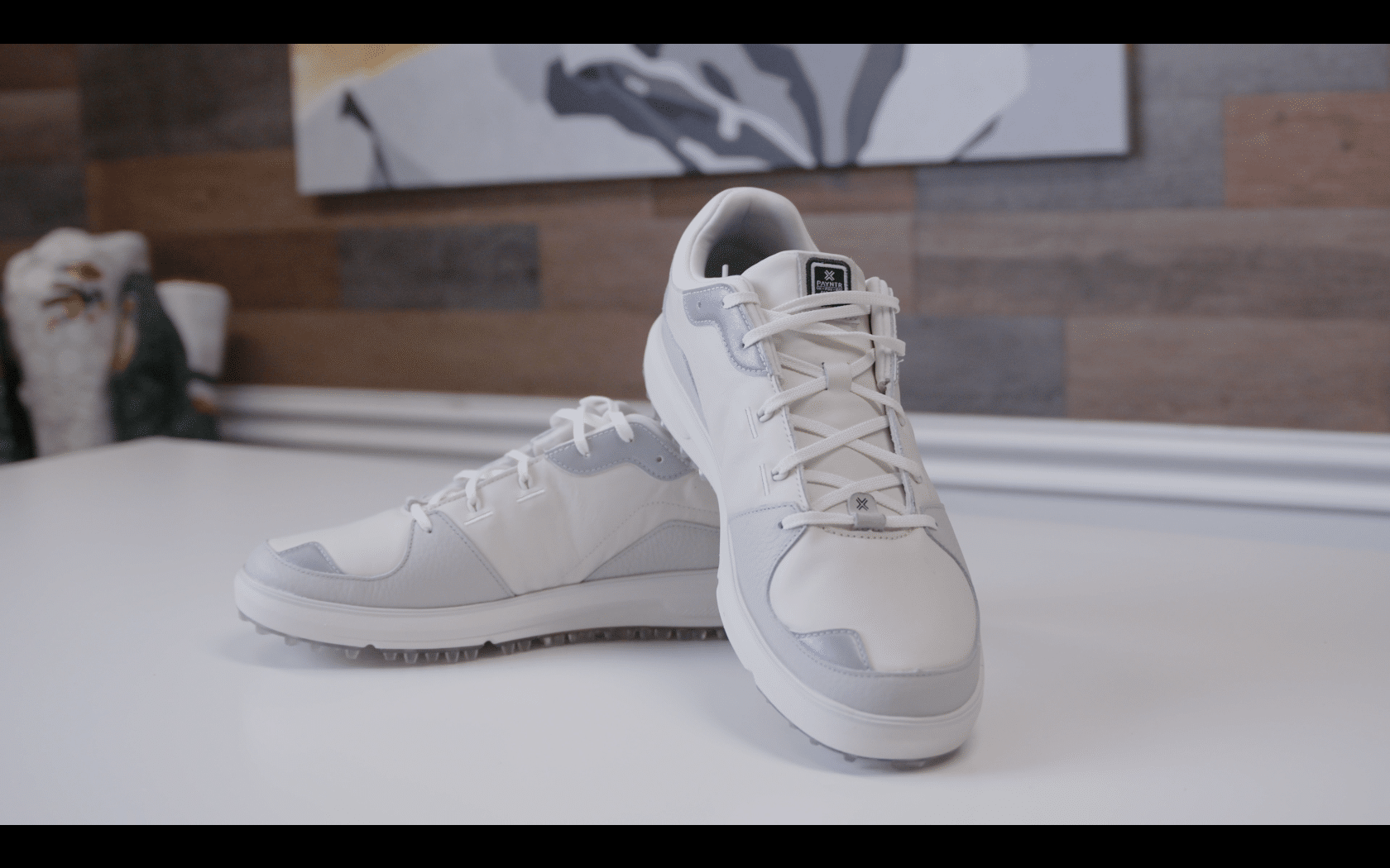 White and gray athletic shoes on table