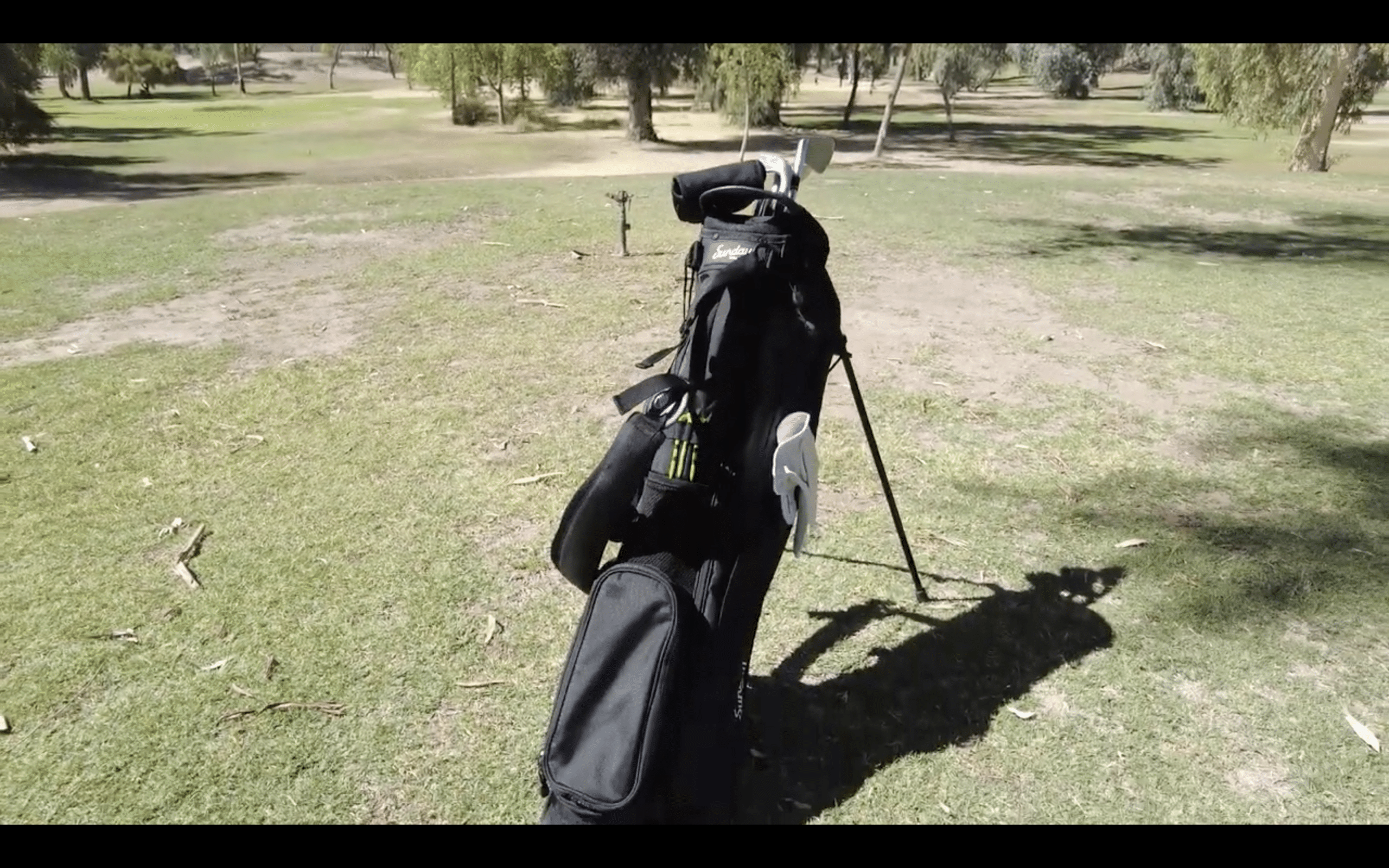 Golf bag on grassy golf course