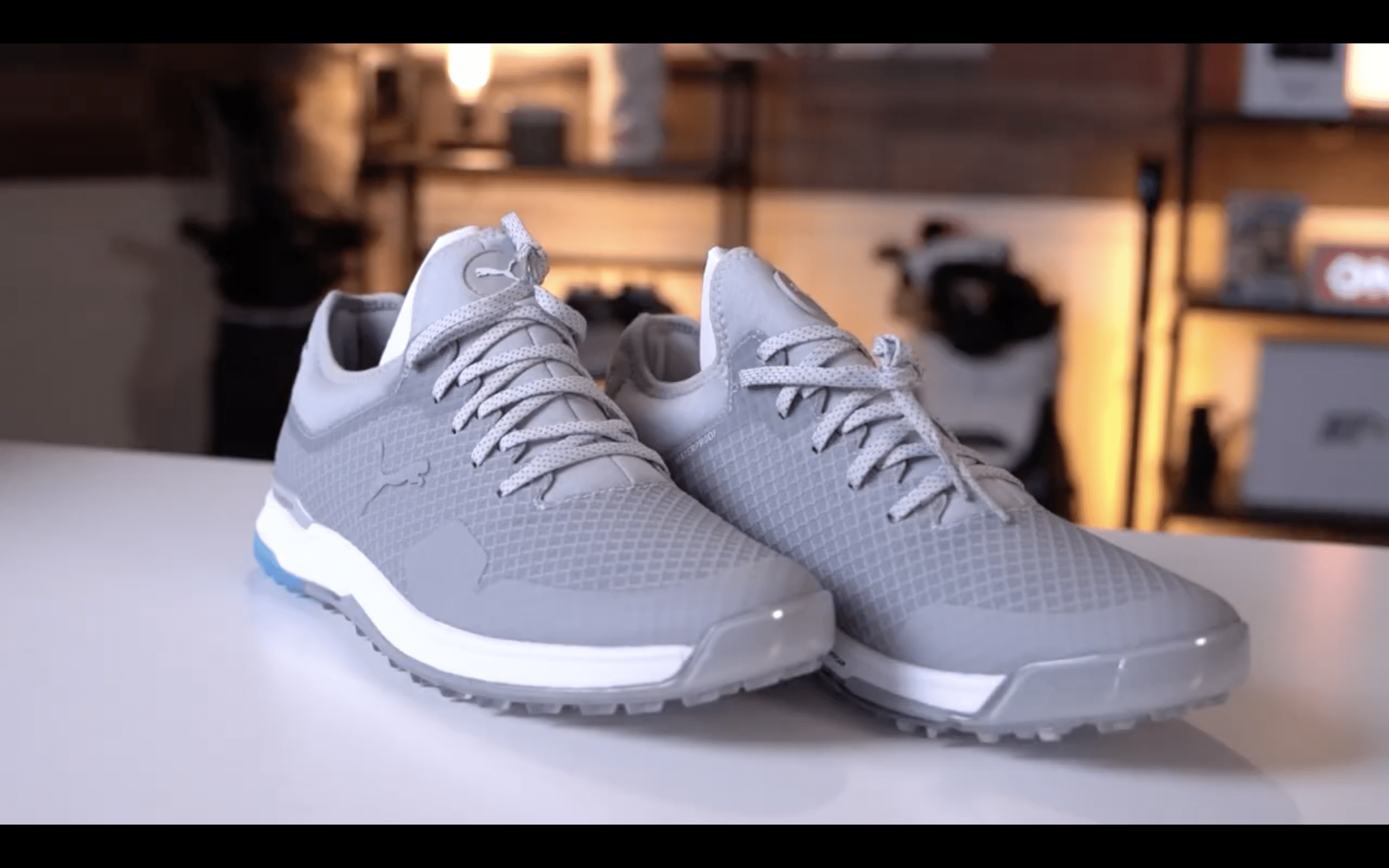 Pair of gray athletic sneakers on table