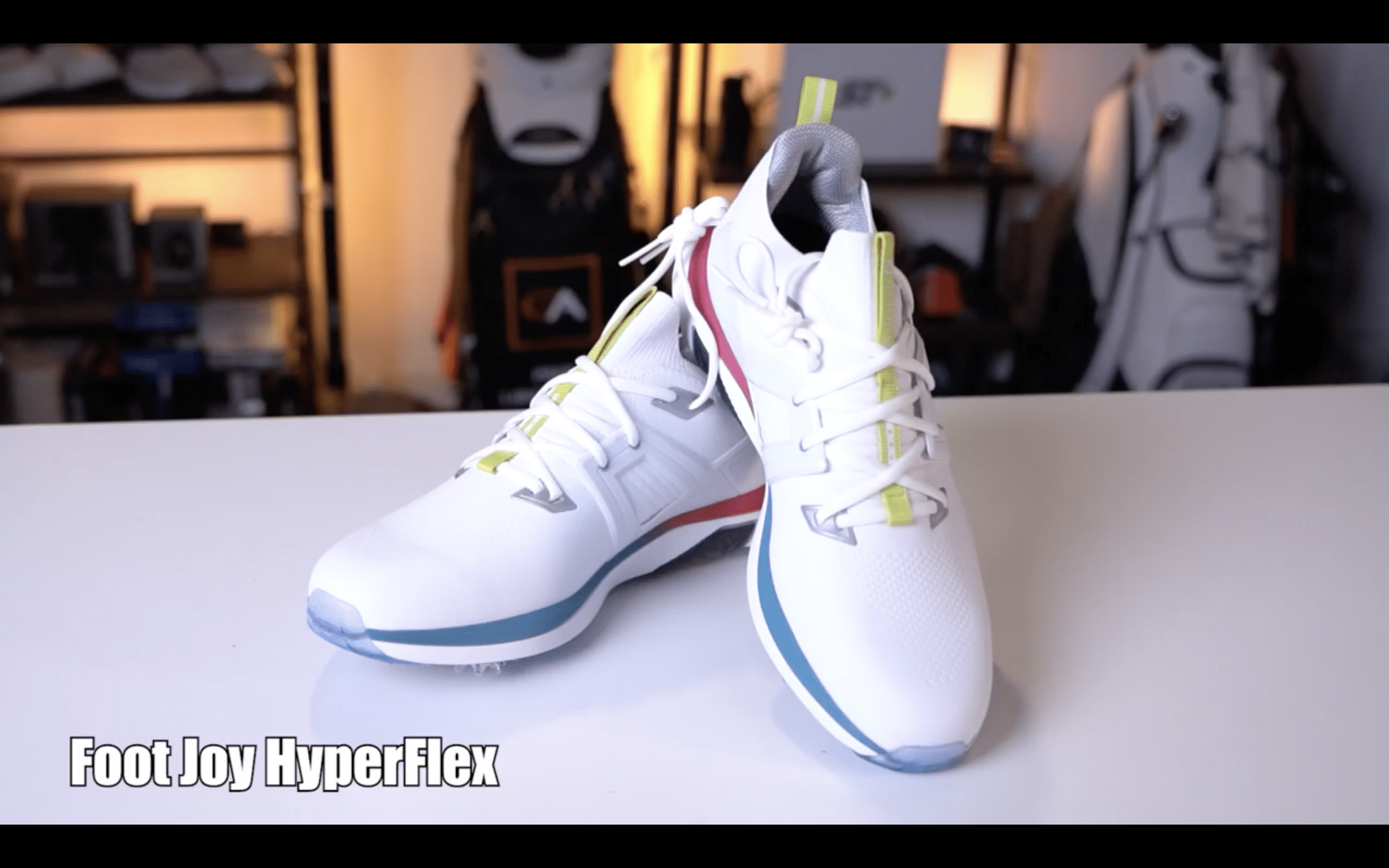 White FootJoy HyperFlex golf shoes on display