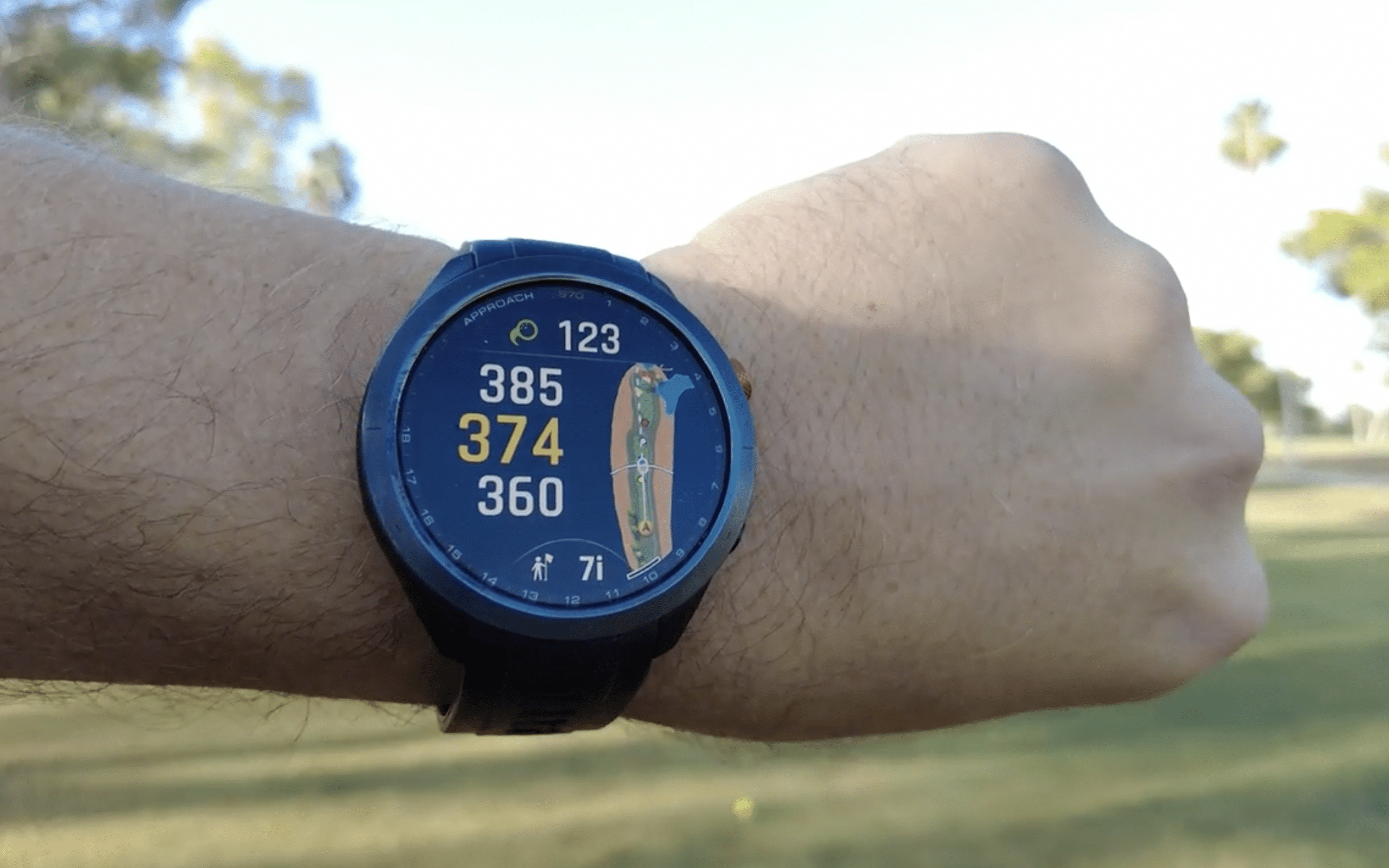 Smartwatch displaying golf course distance data