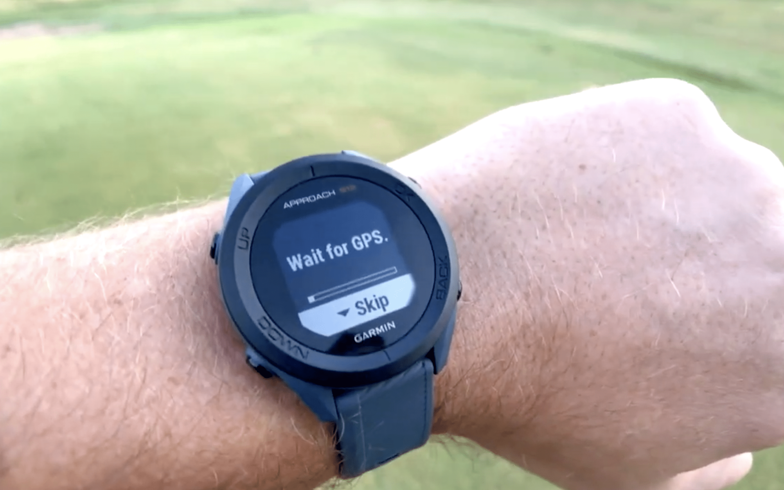 Smartwatch showing wait for GPS screen outdoors