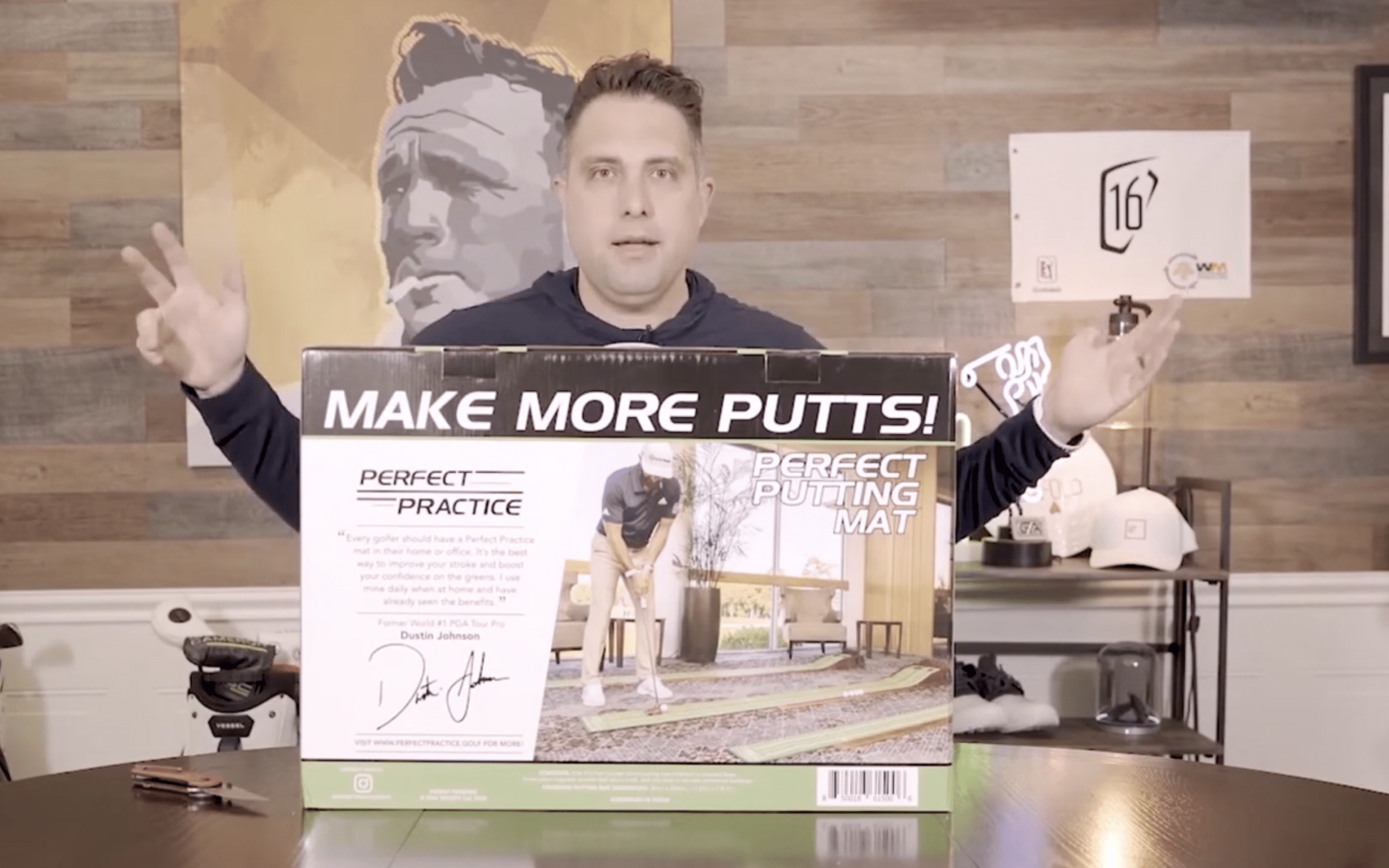 Man presenting Perfect Practice putting mat box