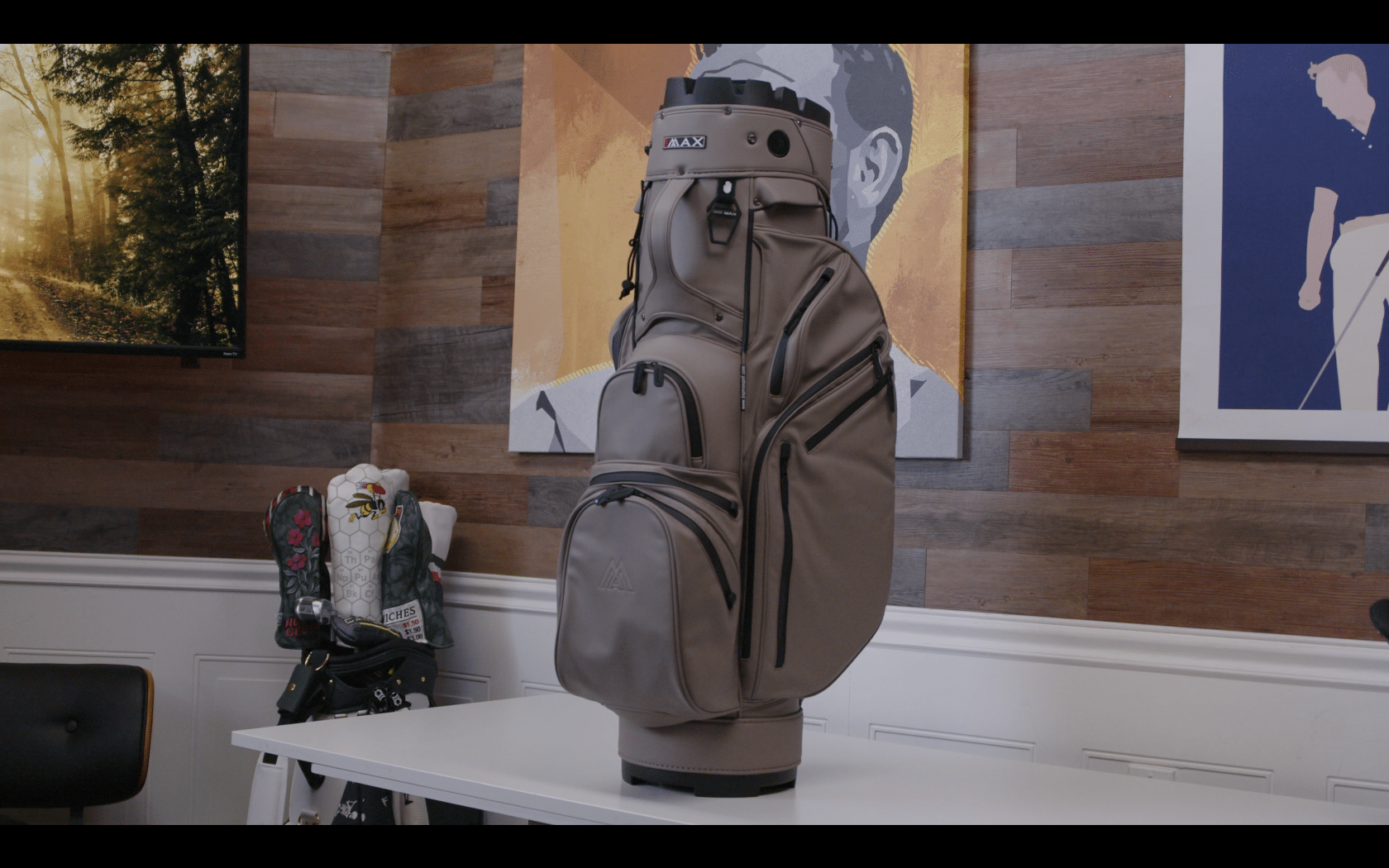 Modern gray golf bag on white table