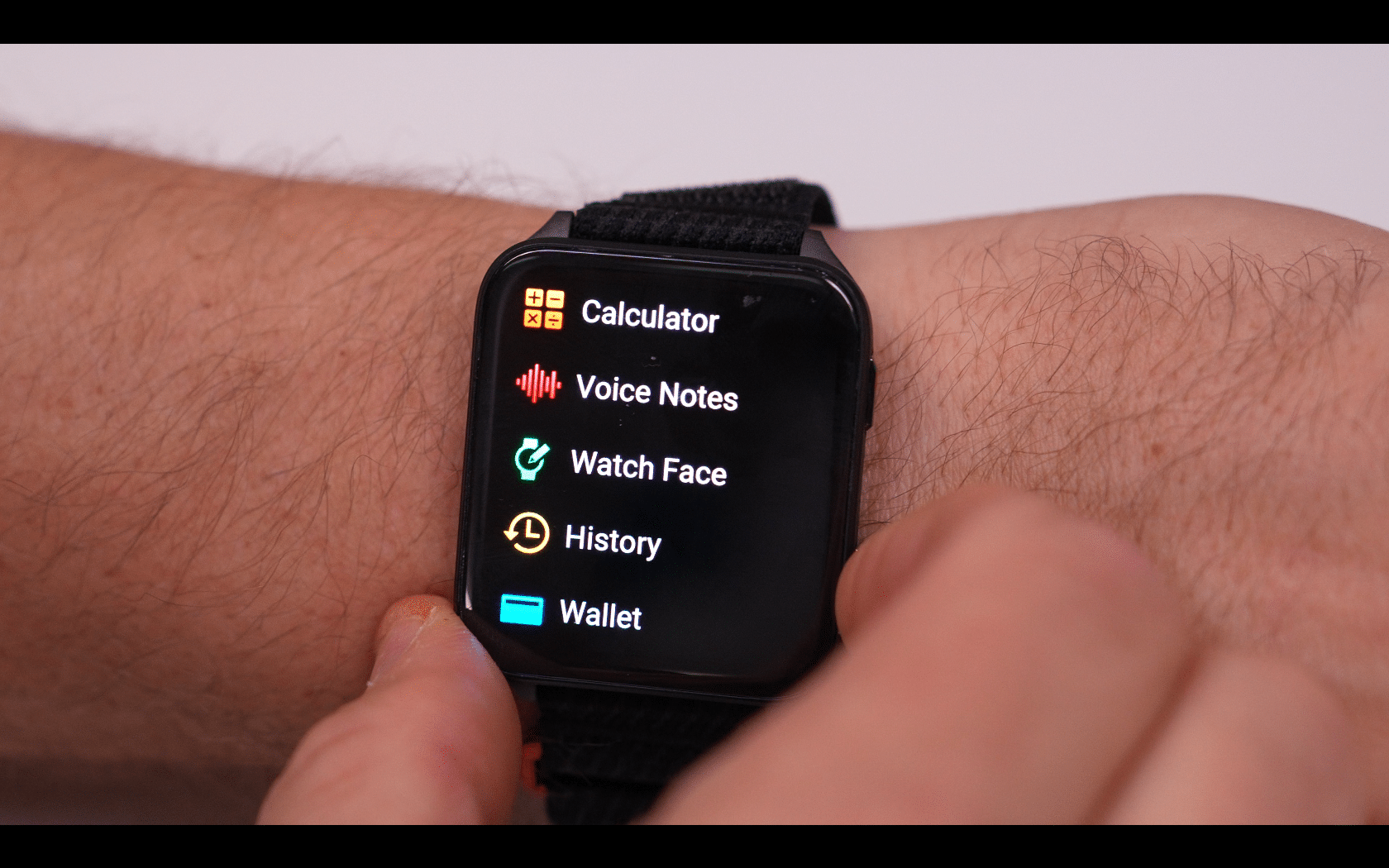 Smartwatch showing app menu on wrist