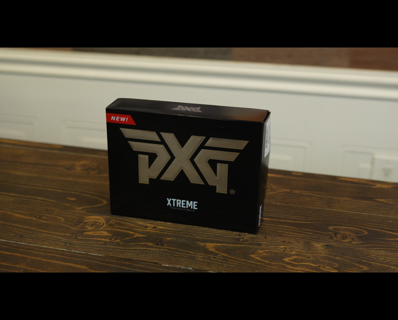 PXG Xtreme golf balls box on table
