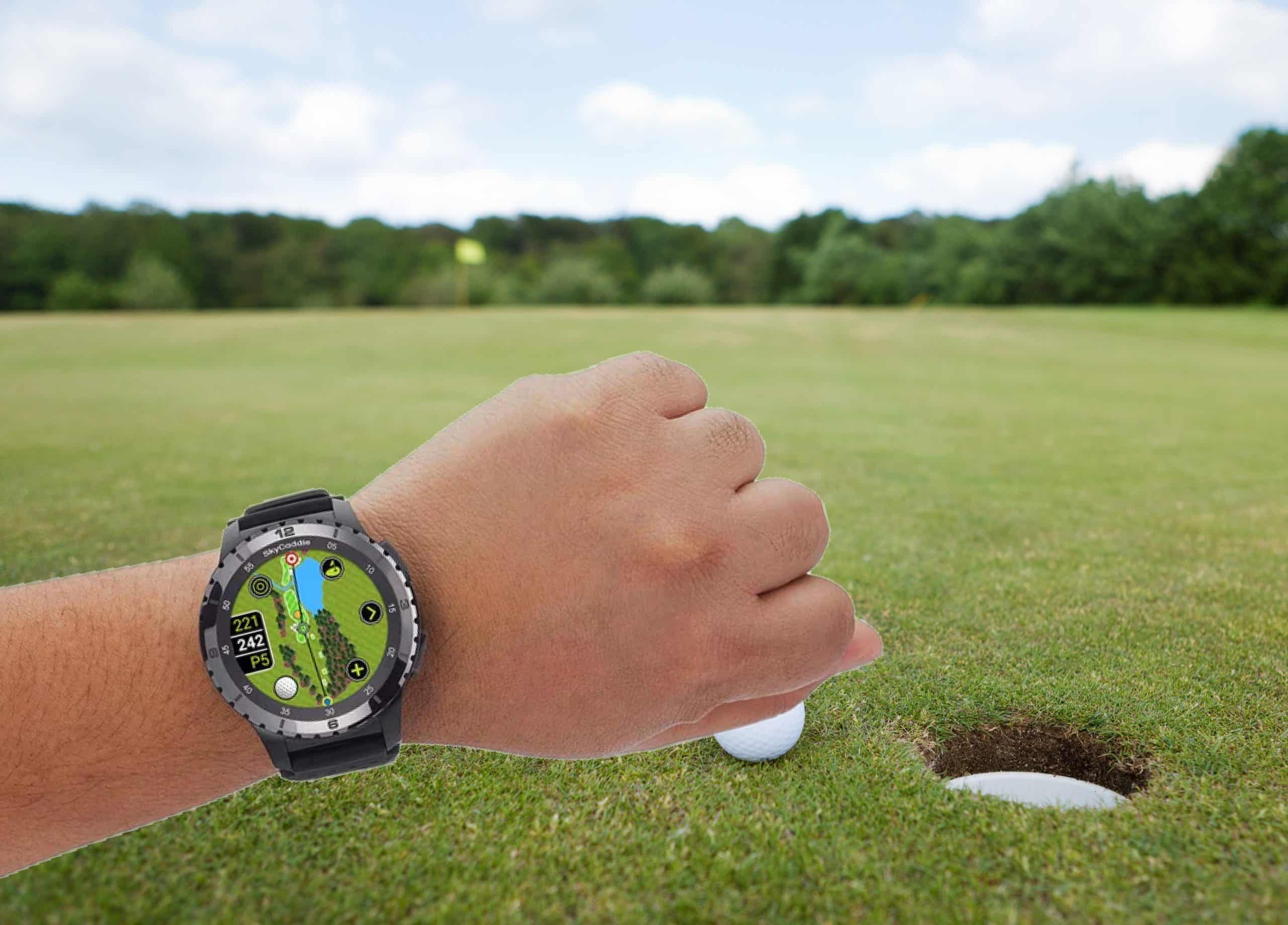 Golfer using smartwatch on green