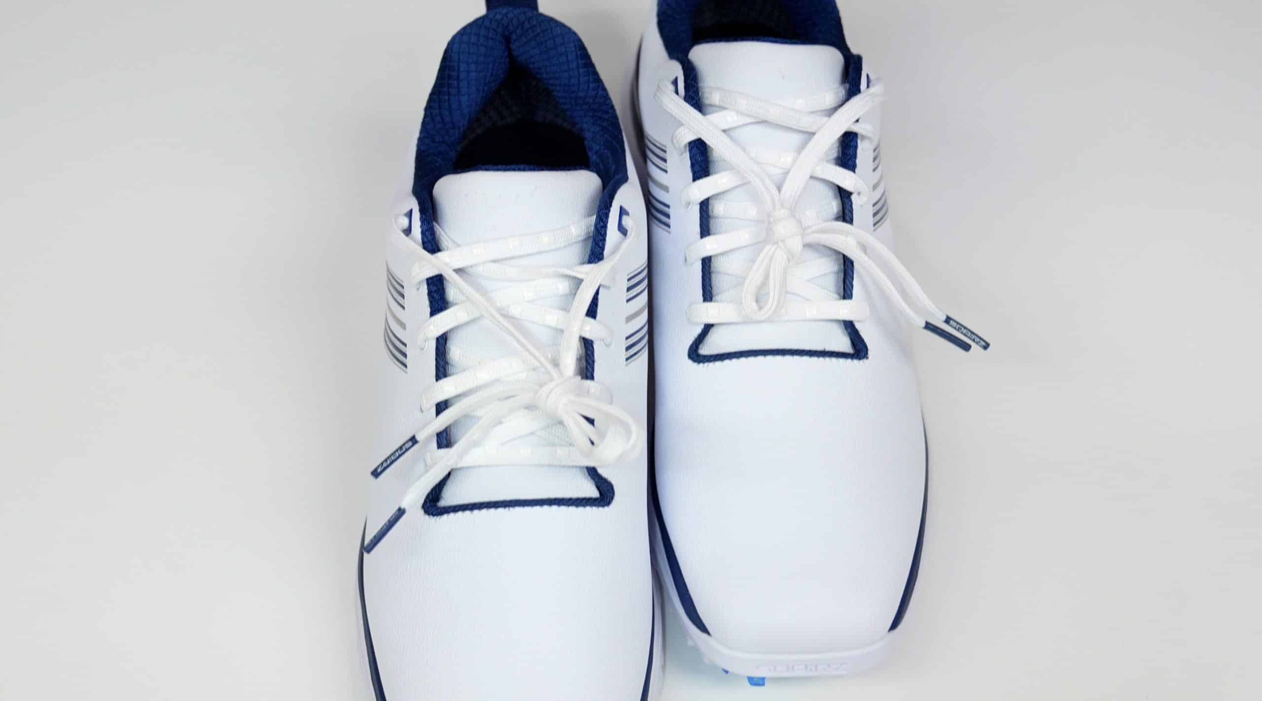 White and blue athletic shoes on white background