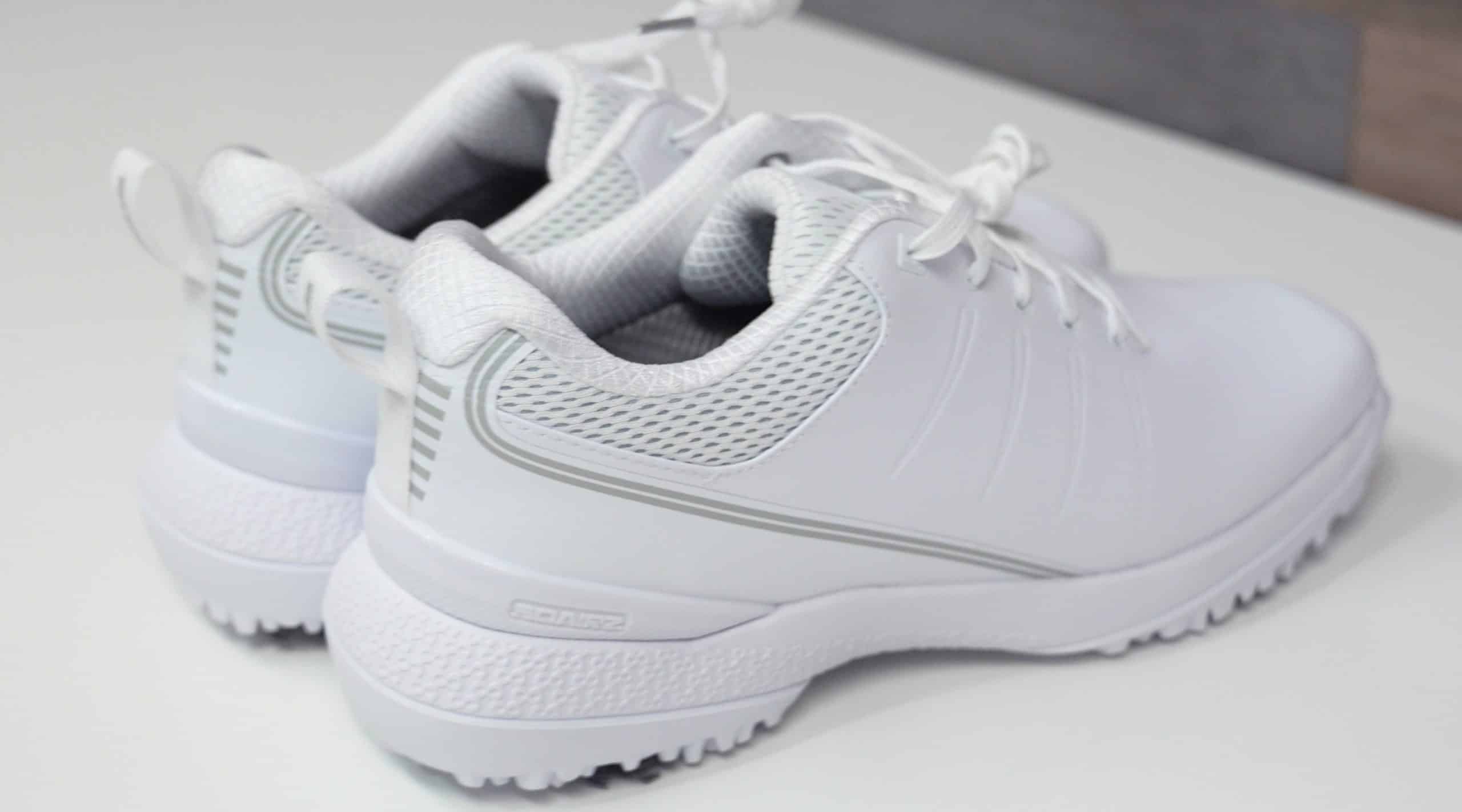 Pair of white athletic golf shoes