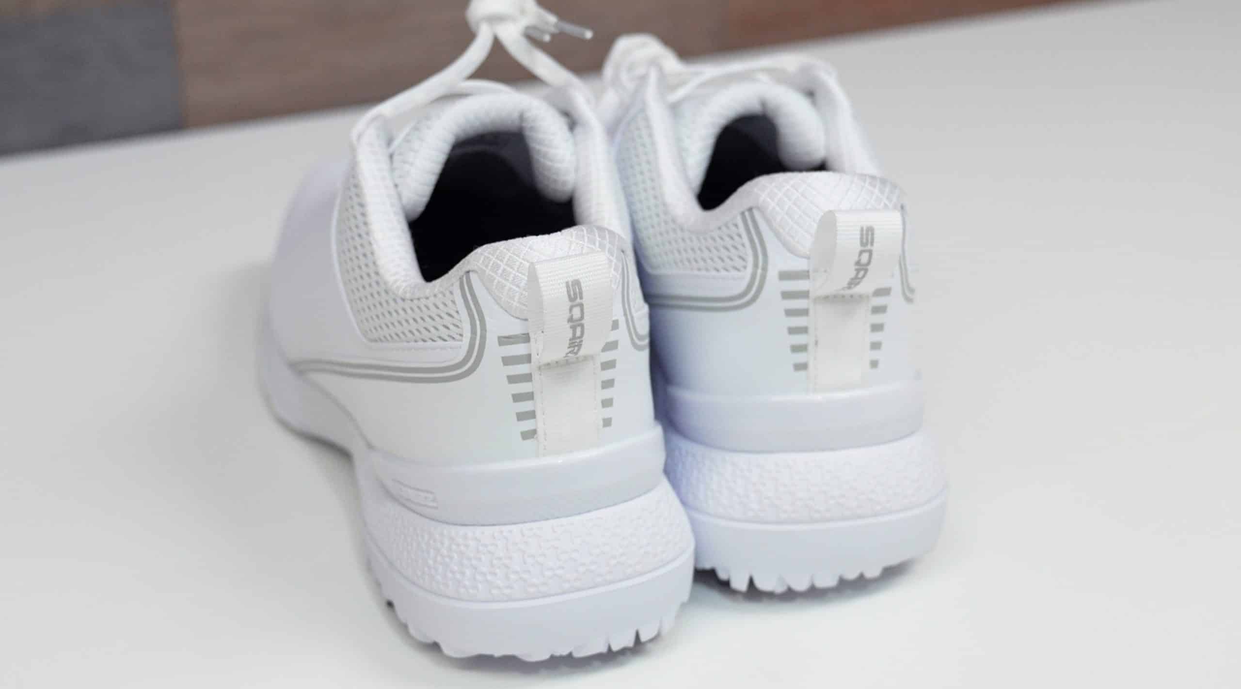 White athletic shoes on a white surface